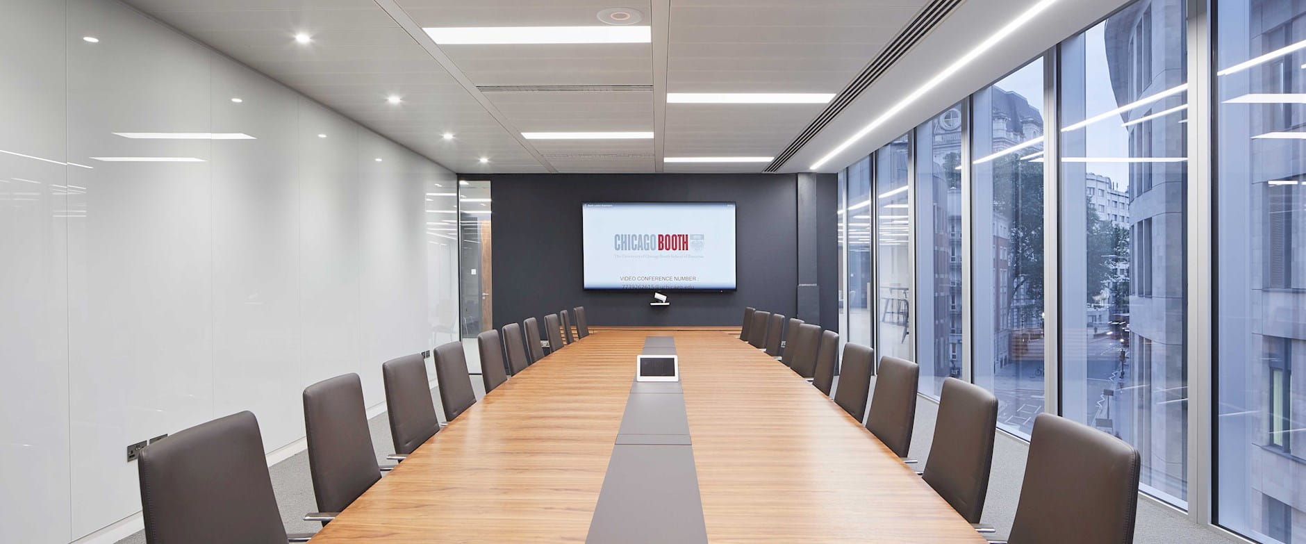 Boardroom table with screen on the wall