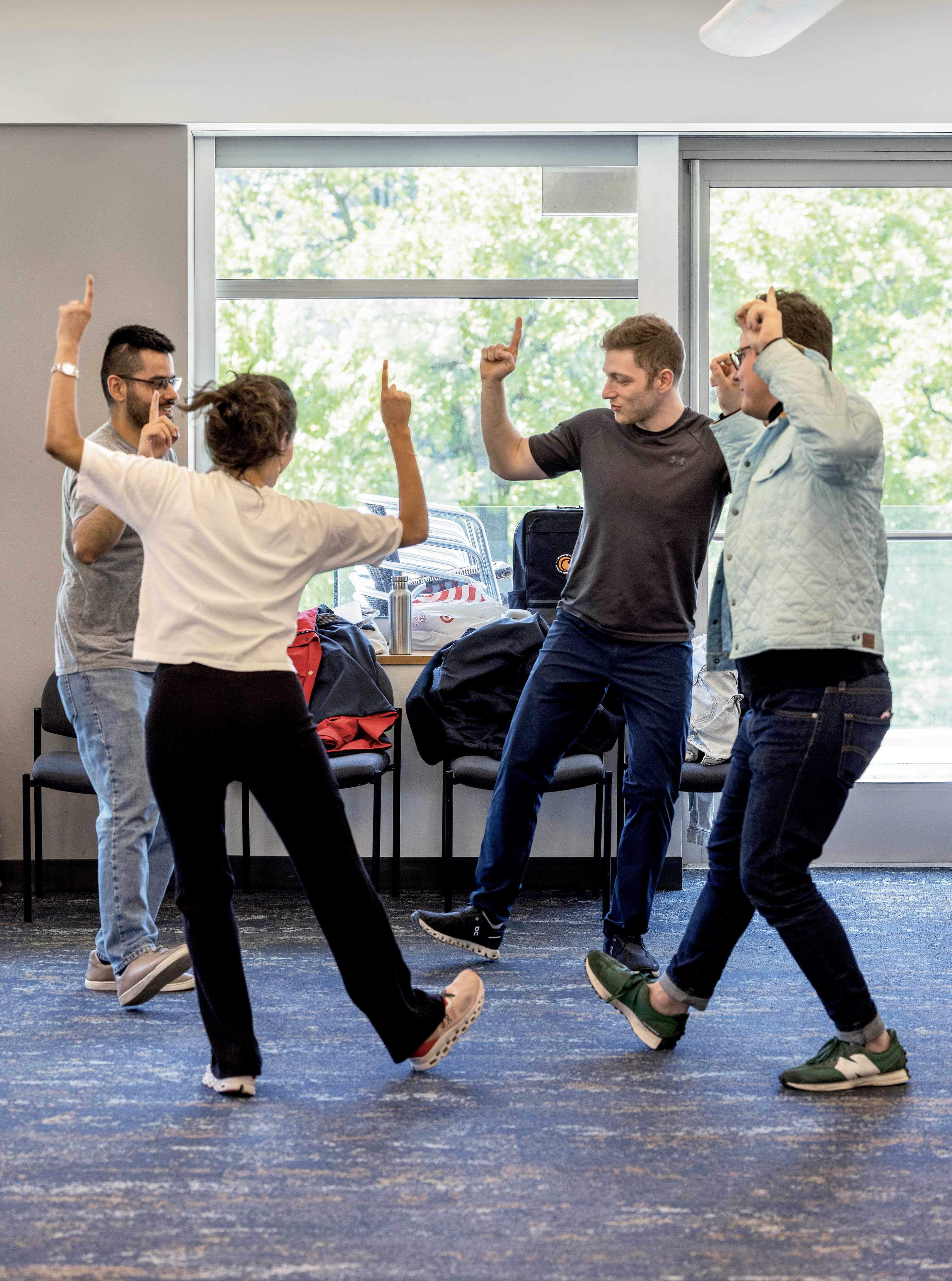A group of people dancing in a circle