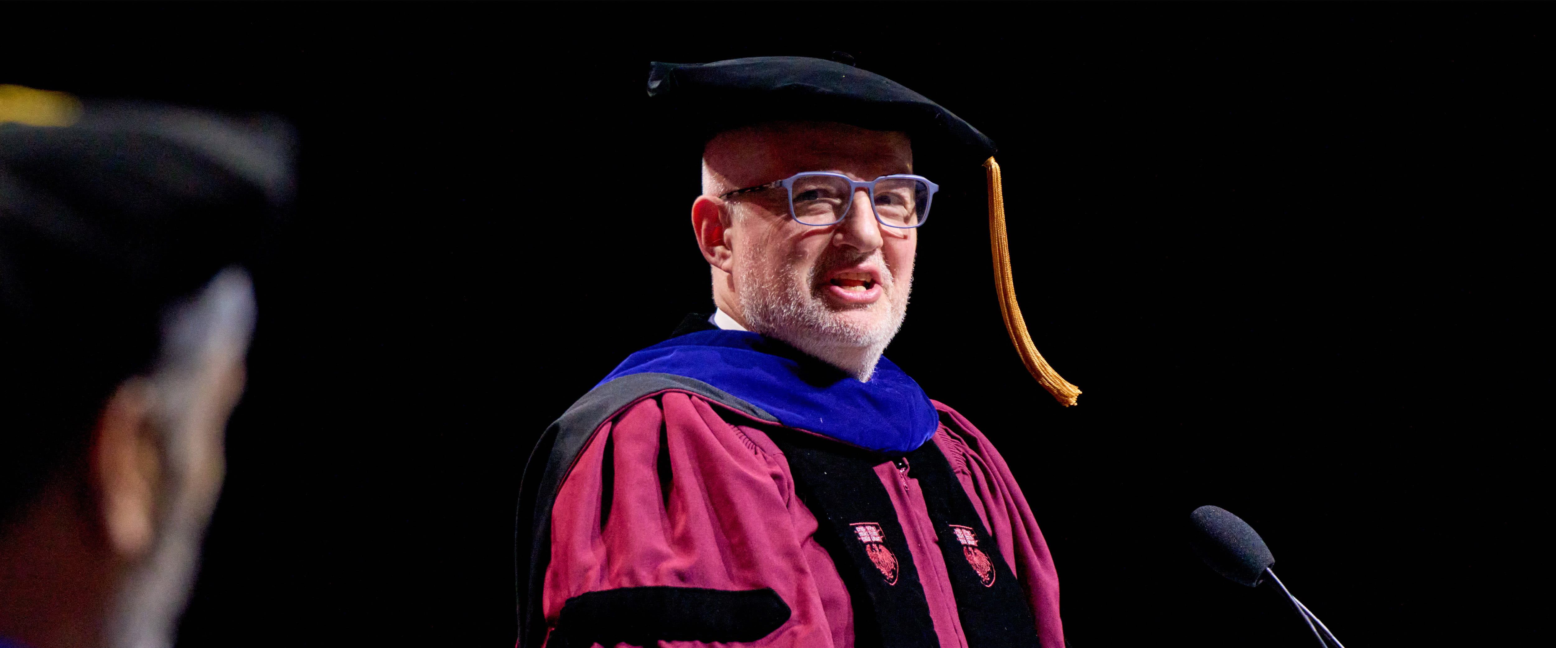 Emmanuel Roman speaks during the 2025 graduation.