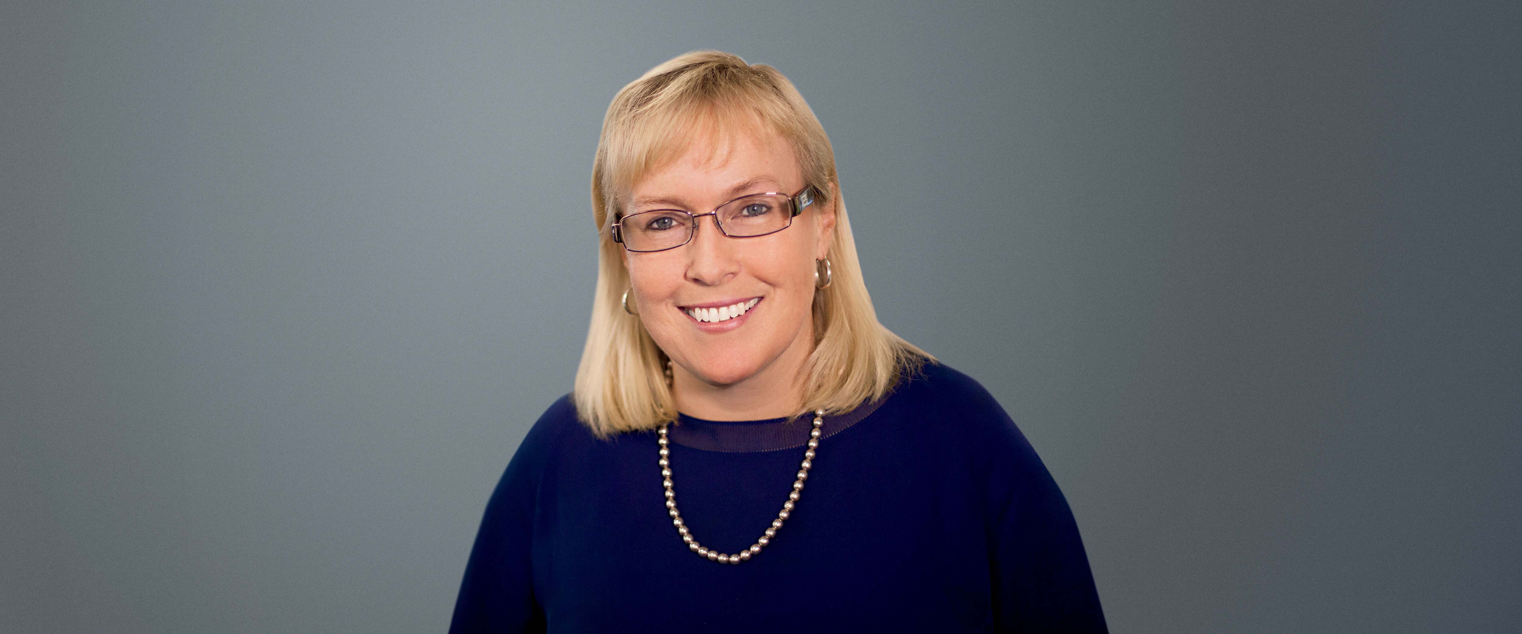 Headshot of Jennifer Ceran, ’89, CFO of Smartsheet, Bellevue, Washington in front of a gray background