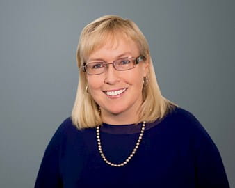 Headshot of Jennifer Ceran, ’89, CFO of Smartsheet, Bellevue, Washington in front of a gray background