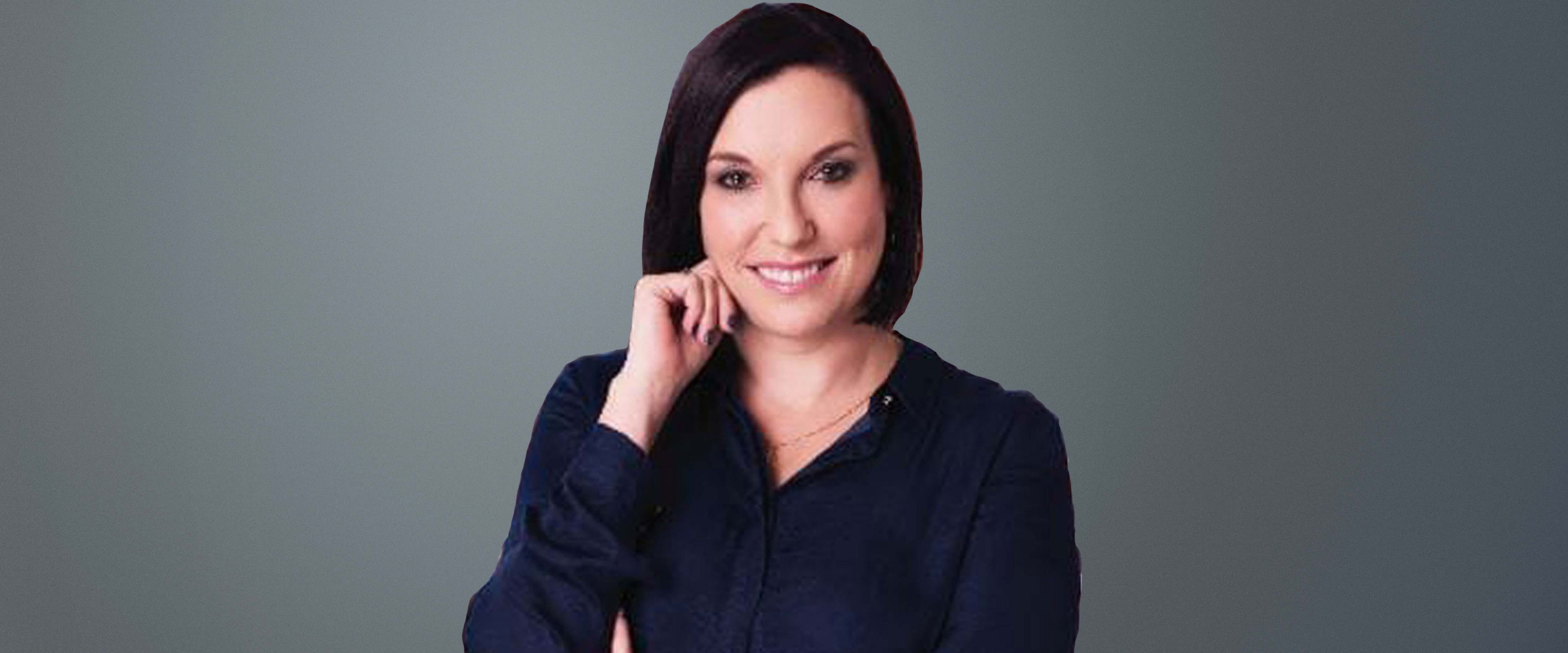 Black and white headshot of Samantha Pokroy, ’04 in front of a gray background
