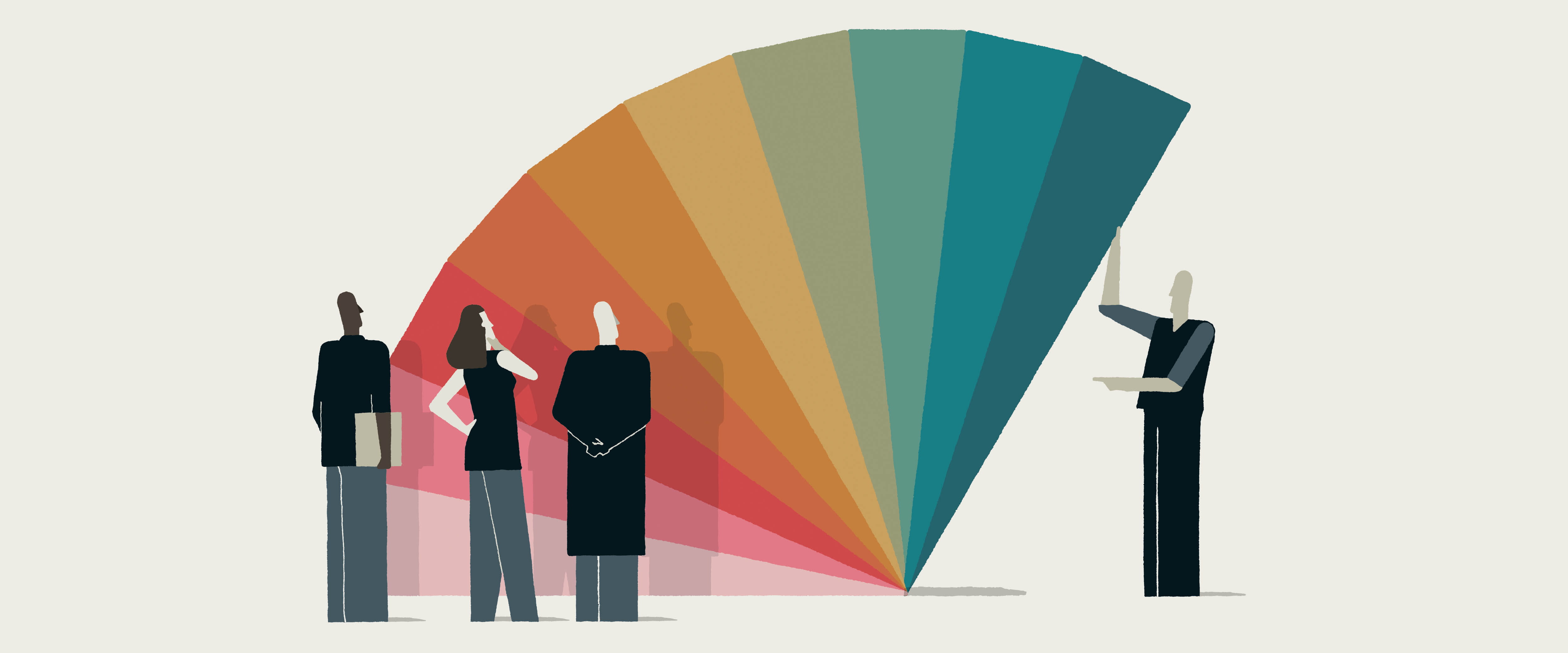 People looking at a large fan with multicolored segments