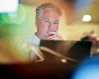 A man looking at his computer screen