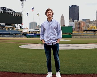 Zach Aldrich standing at a baseball field