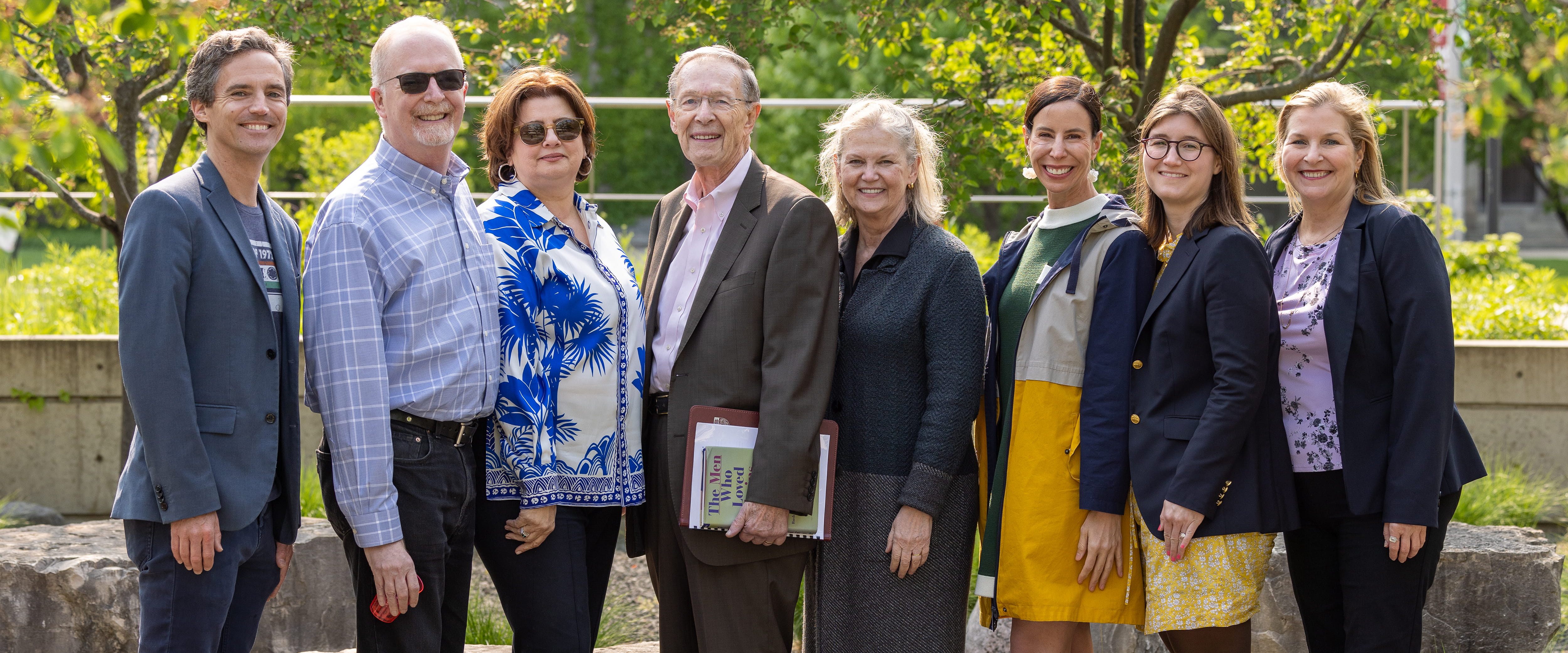 Harry Davis smiling and posing with his family