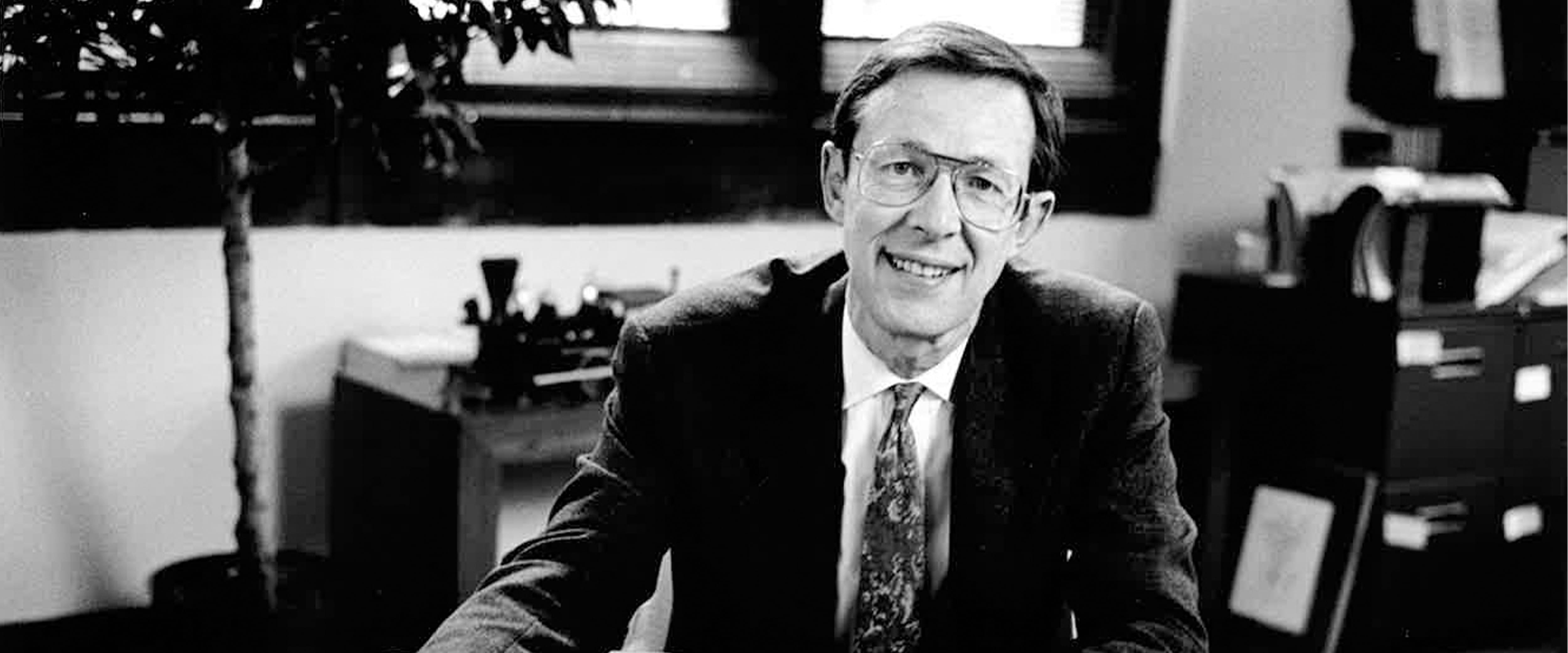 A young Harry Davis smiling in a classroom