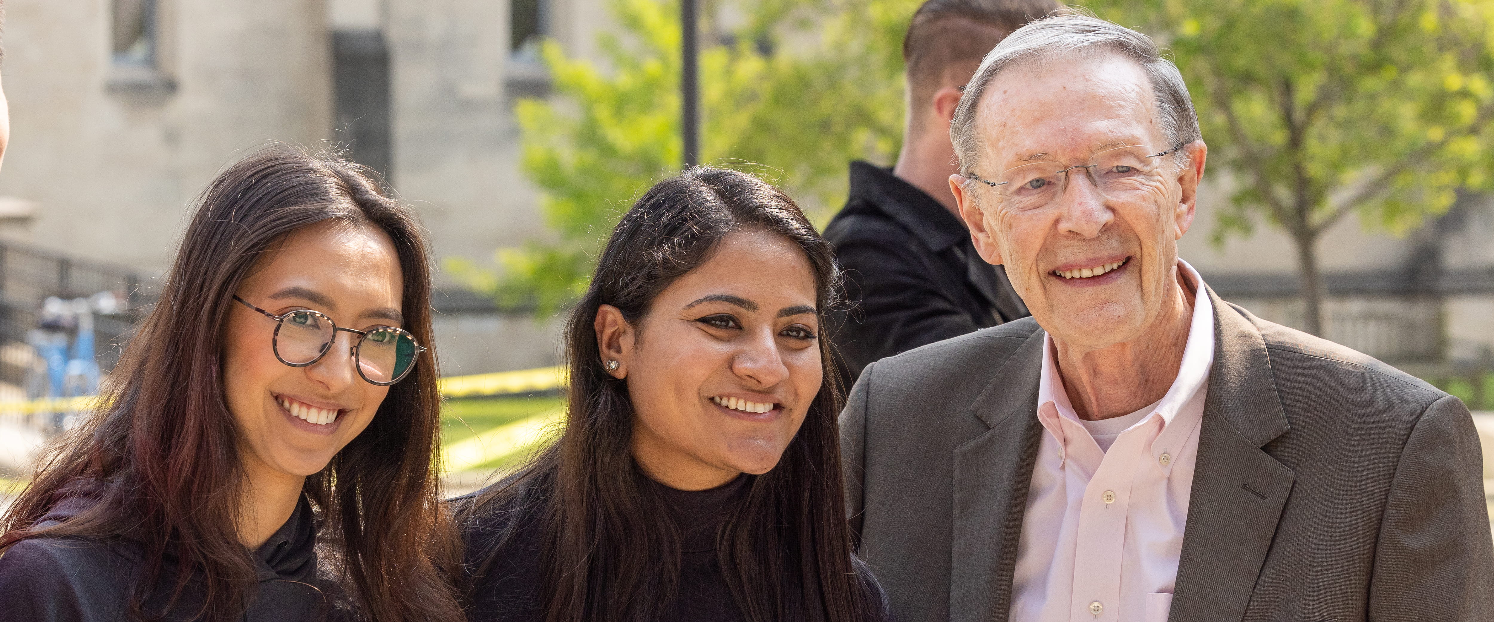 Harry Davis posing with his students