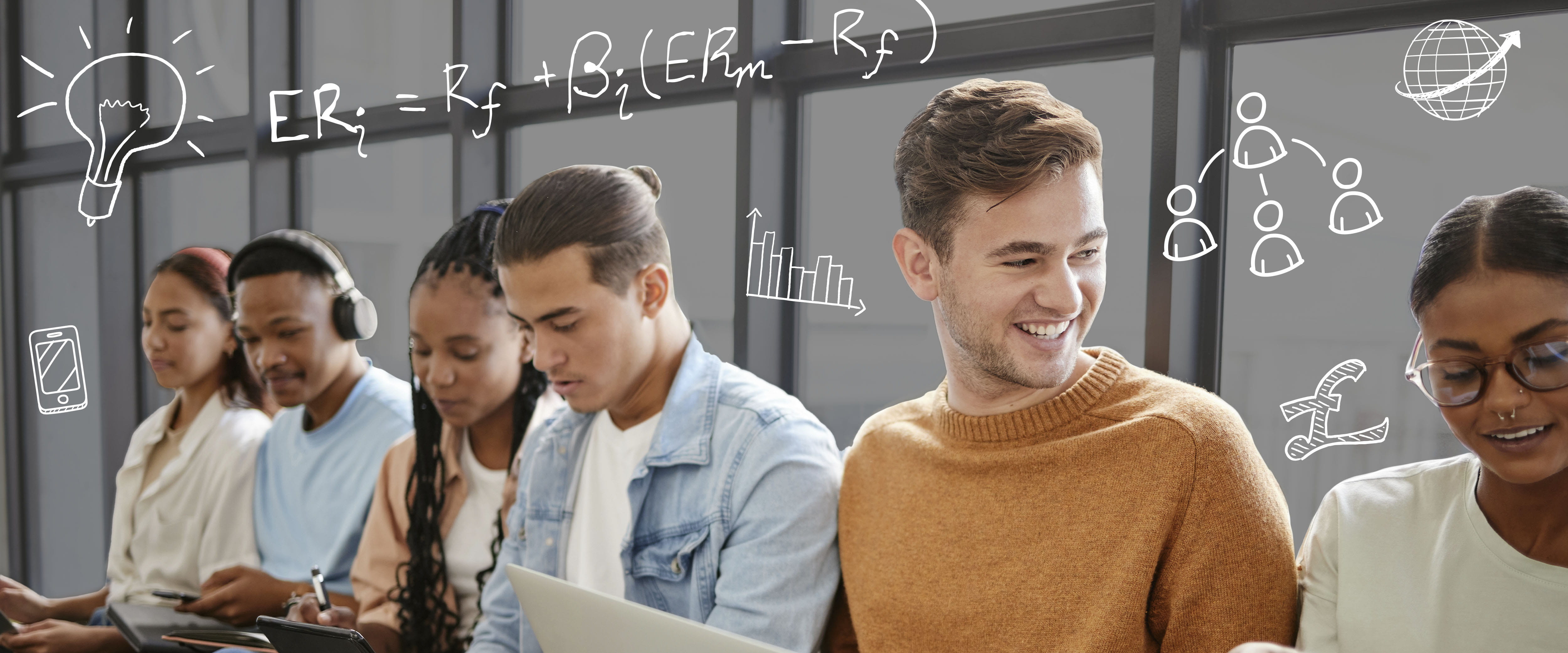 A group of students sitting and talking in front of a window