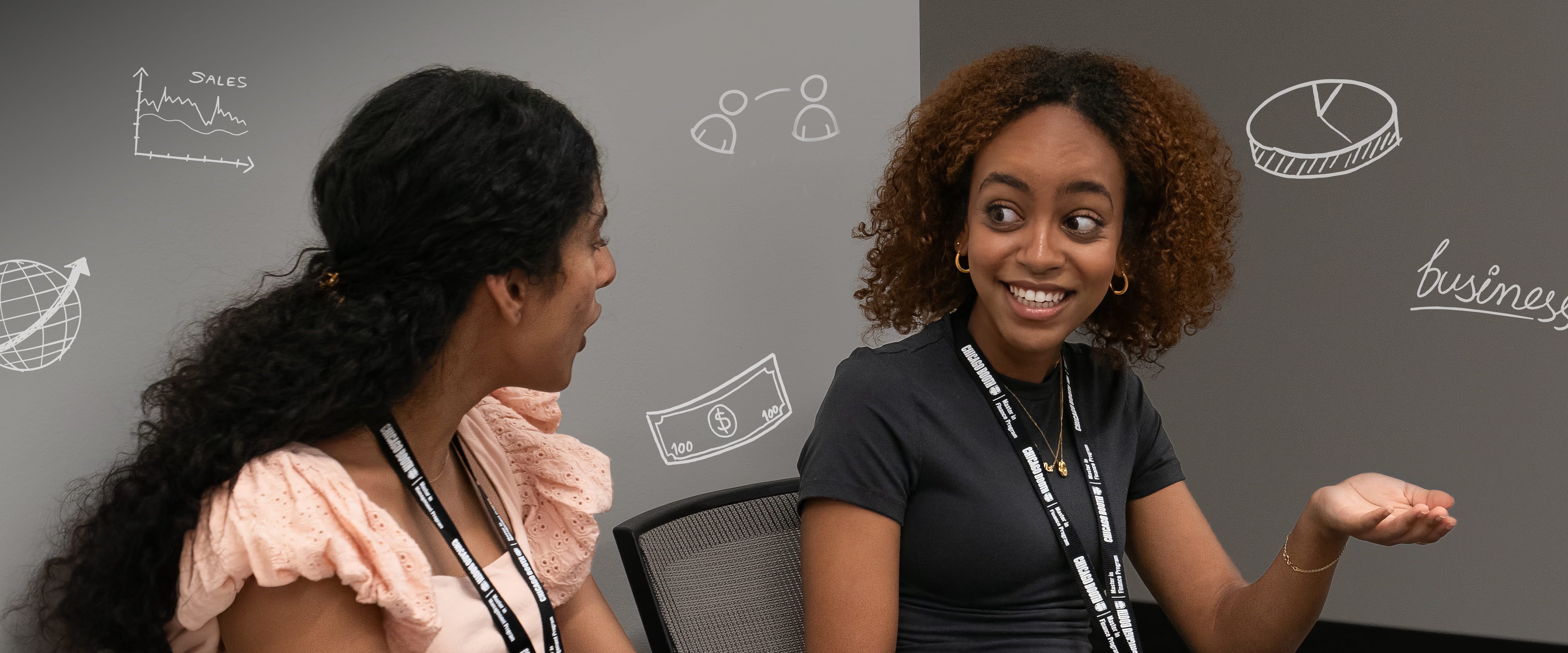 Two MFin students speaking with business icons in the background