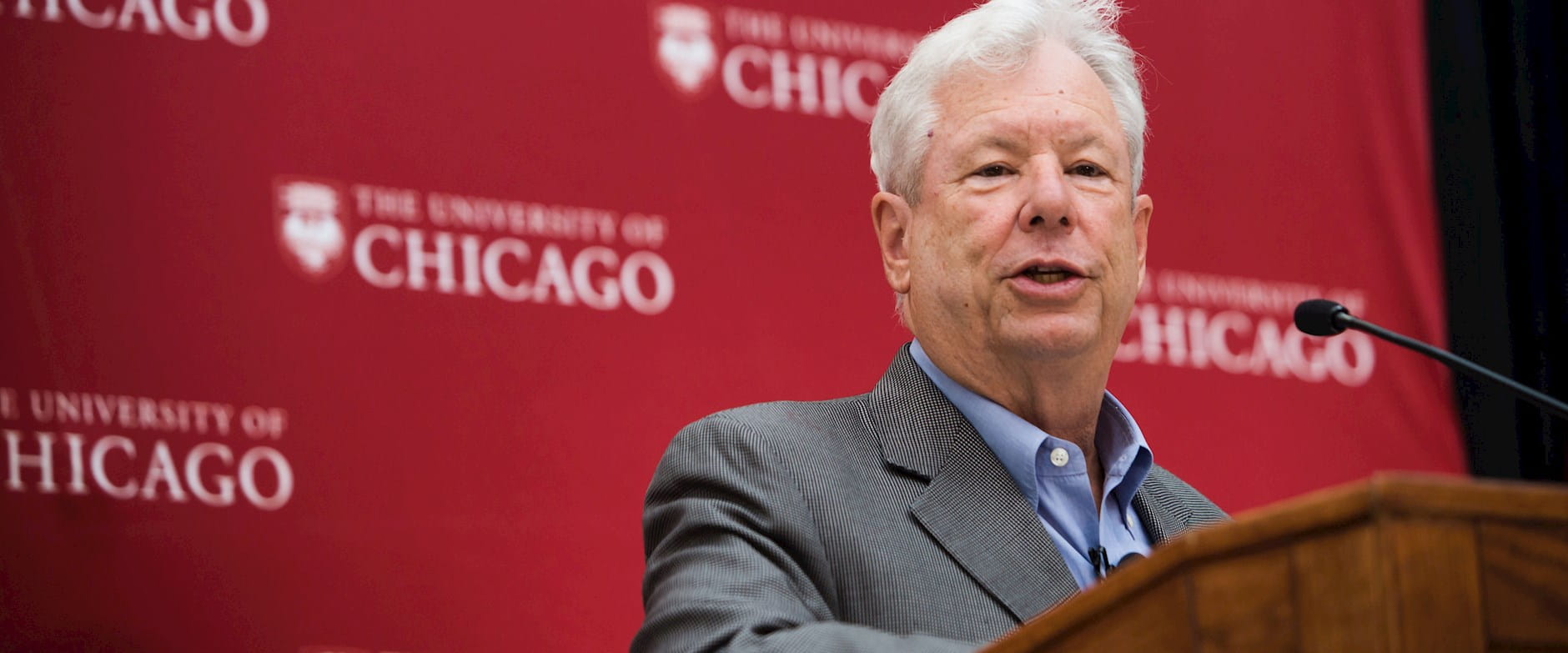 Chicago Booth Professor Richard Thaler standing at a podium, speaking after winning the 2017 Nobel Prize in Economics before a press conference at Harper