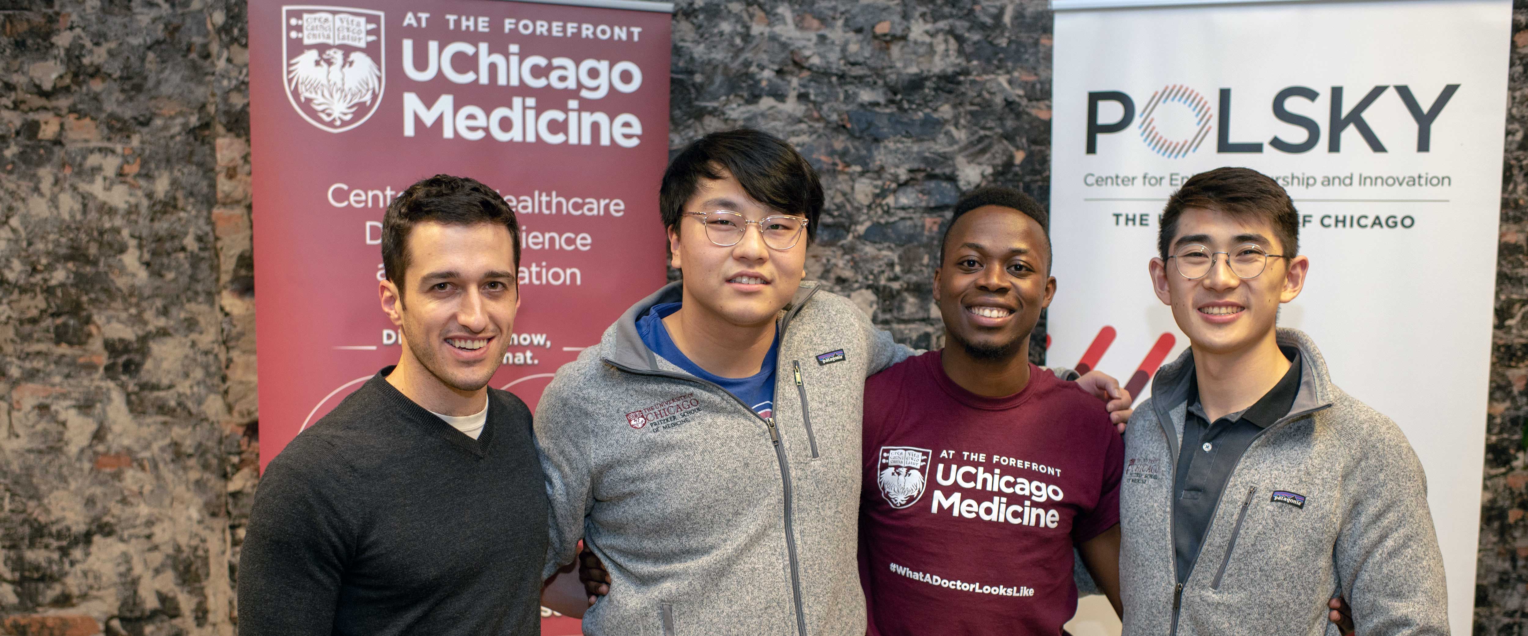 Students posing for a picture at the Polsky Exchange