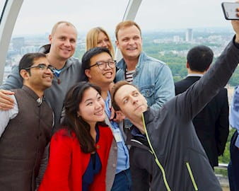 Executive MBA students taking a group selfie