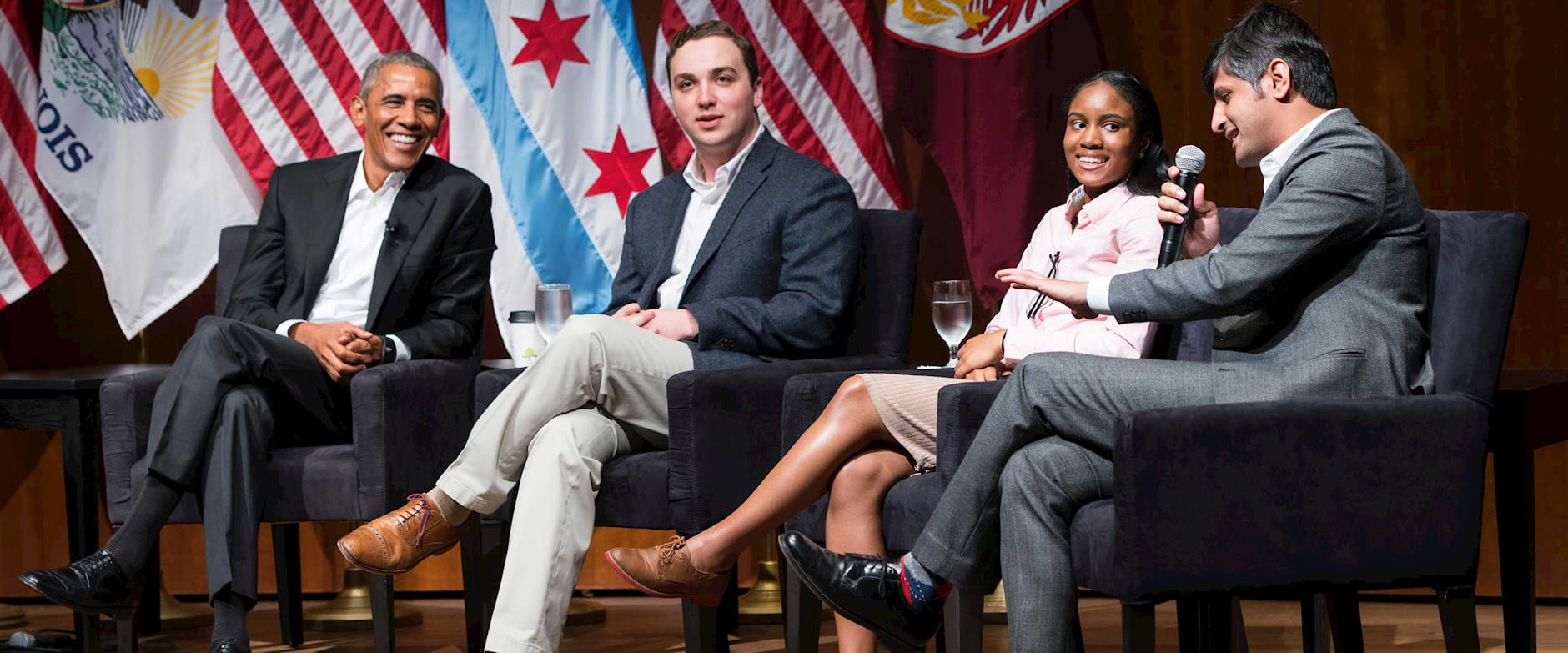 Barack Obama with a panel on stage