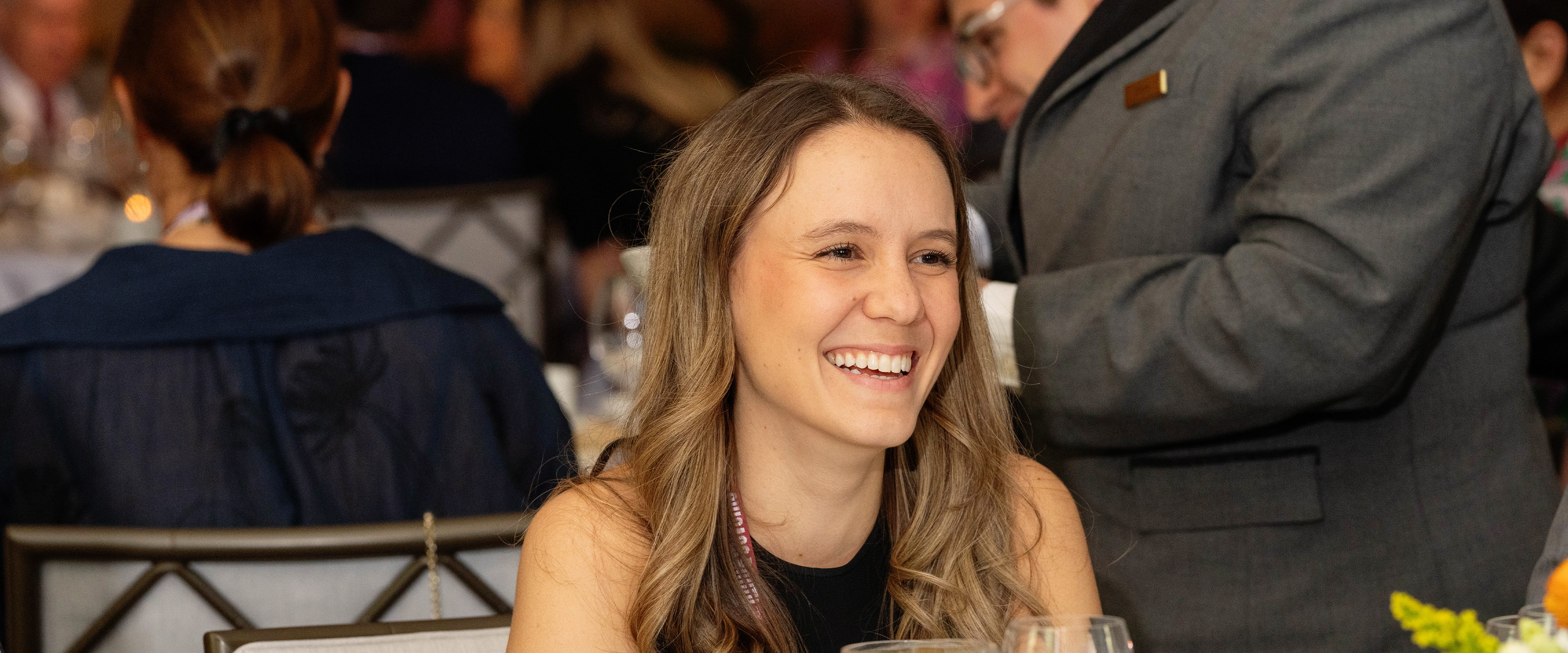 Student laughing at a networking business event
