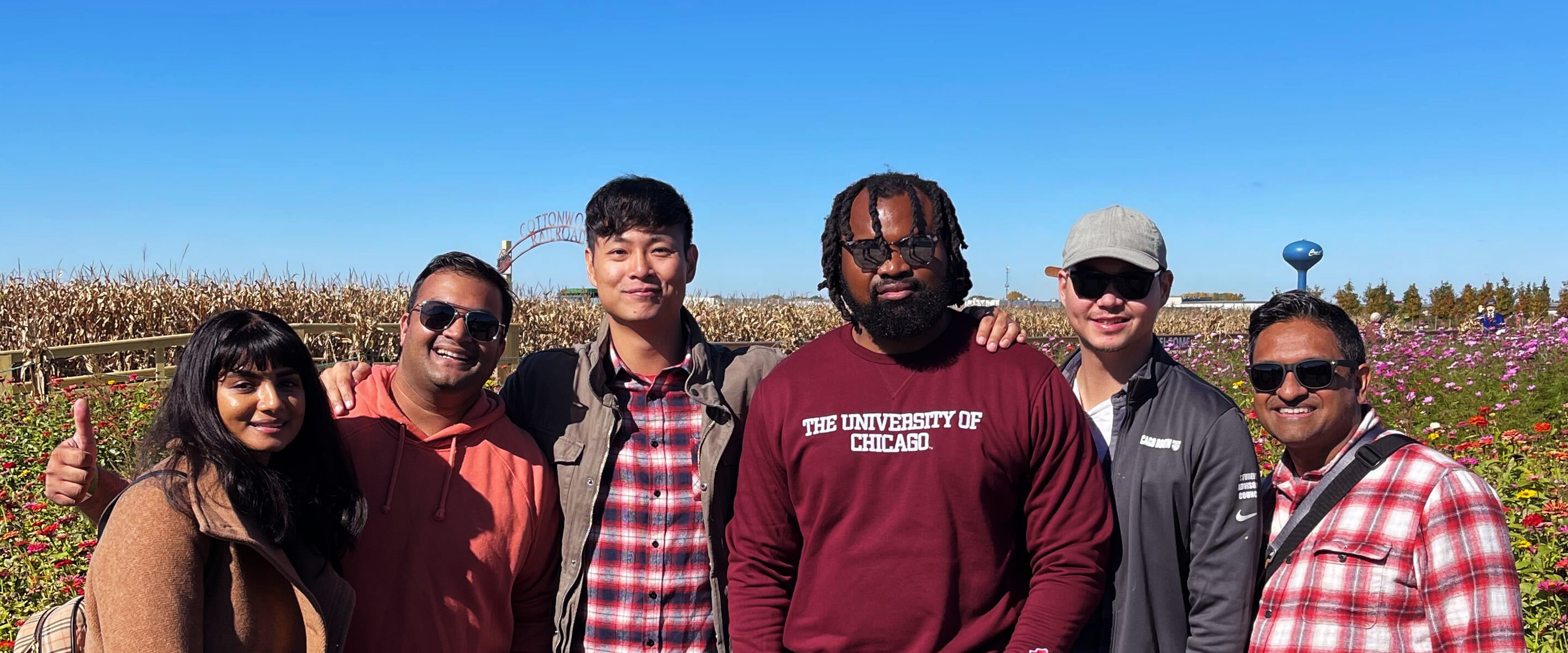 Booth students at an outdoor corn maze and pumpkin patch