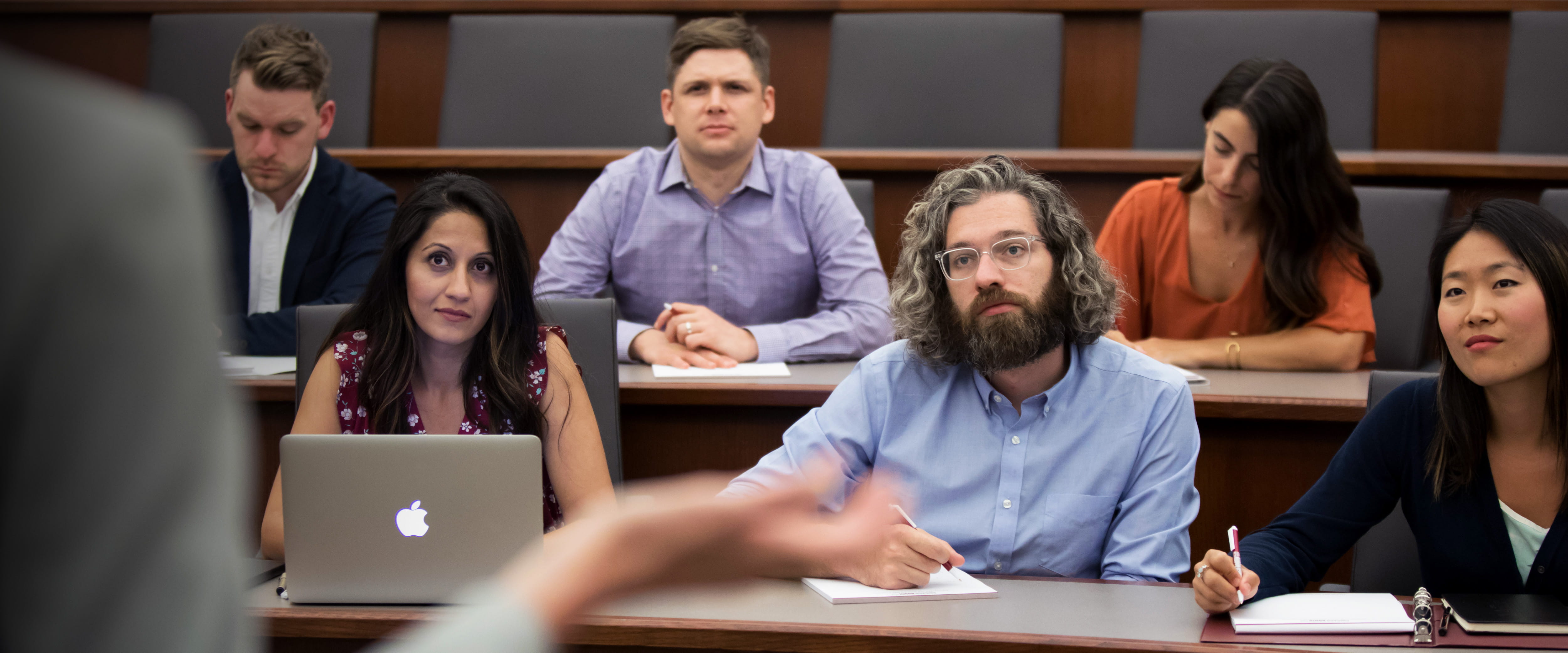 Students listening to professor in class