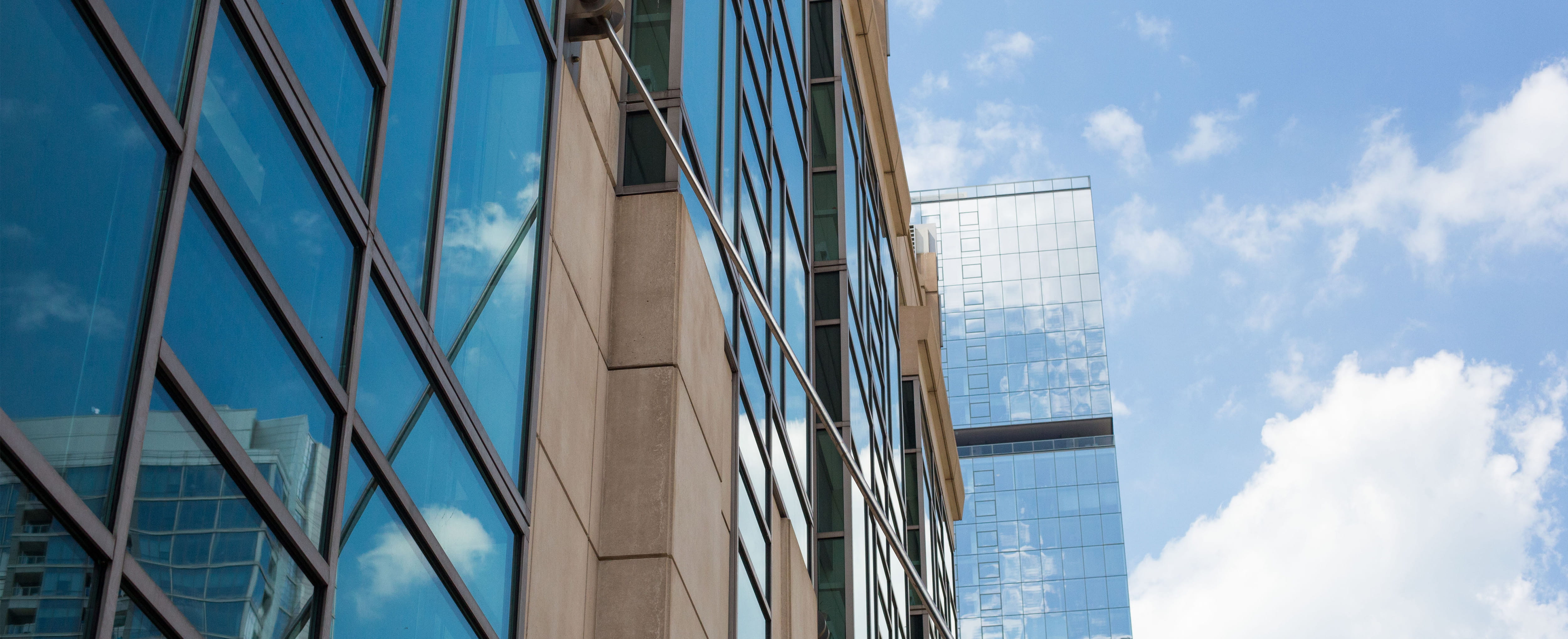 Gleacher Center exterior windows with clouds reflected