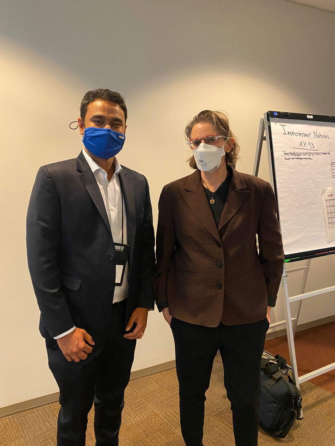 Two Chicago Booth EMBA students wearing masks