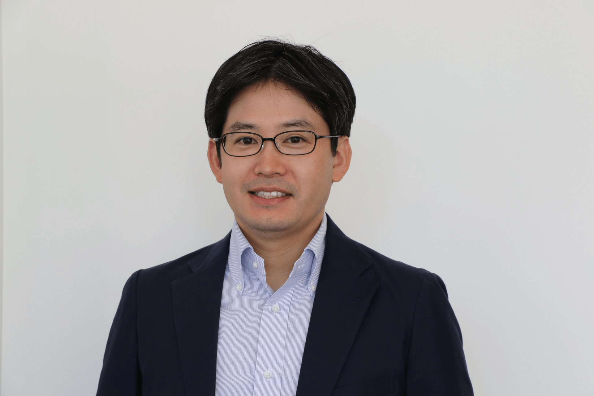 Head shot of a man wearing a dark jacket