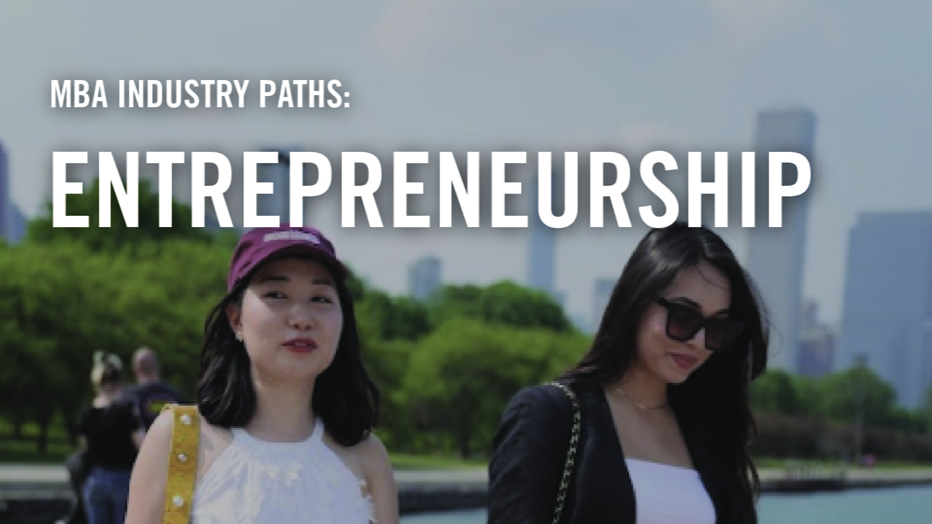 A Booth student and a friend walk along the lake shore downtown. 