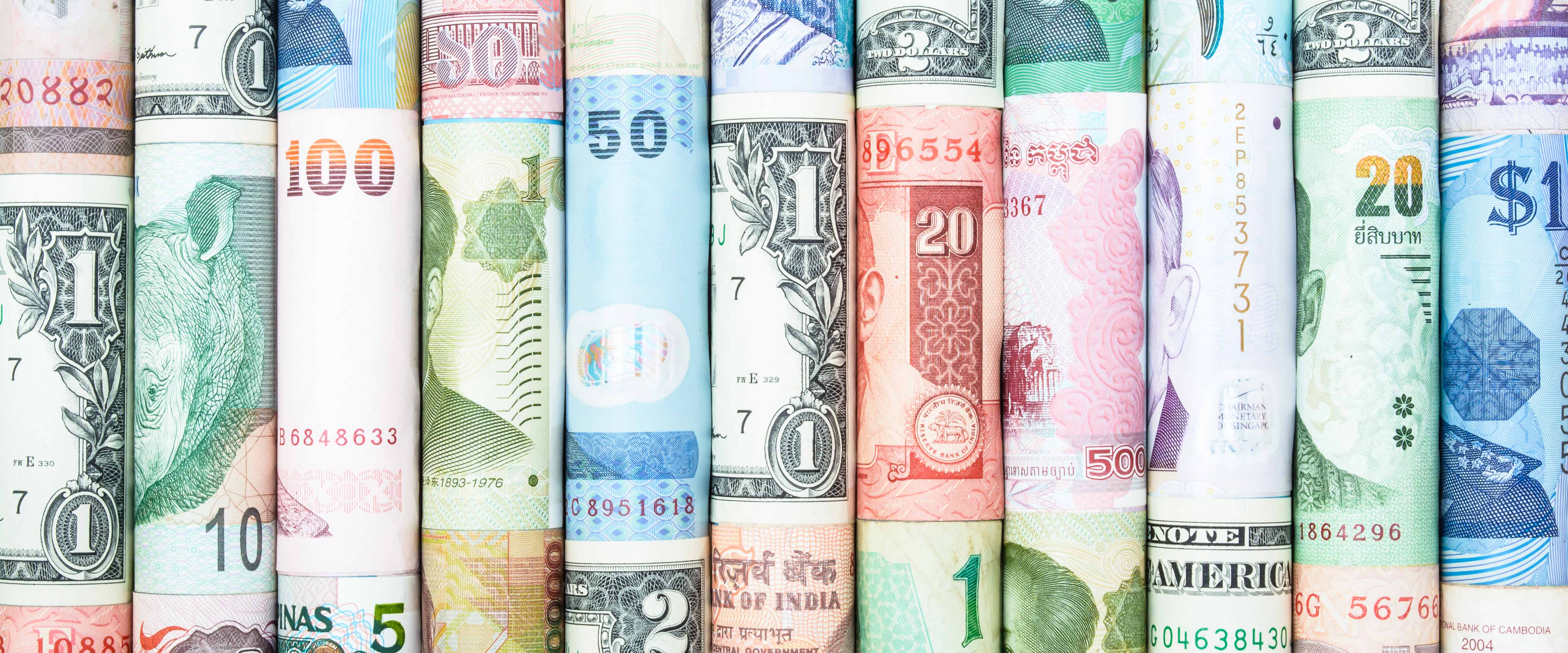 Rolled up currency from many different countries