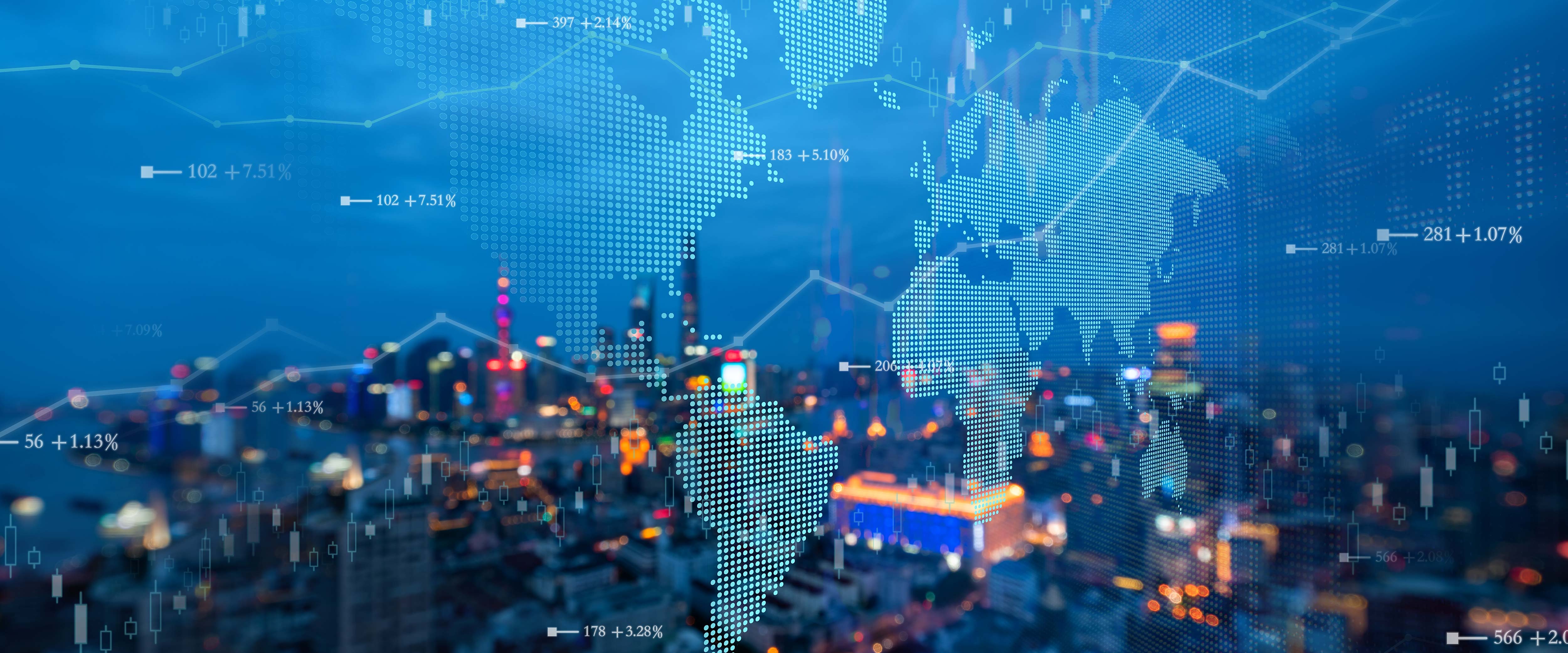 Map of the world overlayed against a city with financial graphs in the foreground