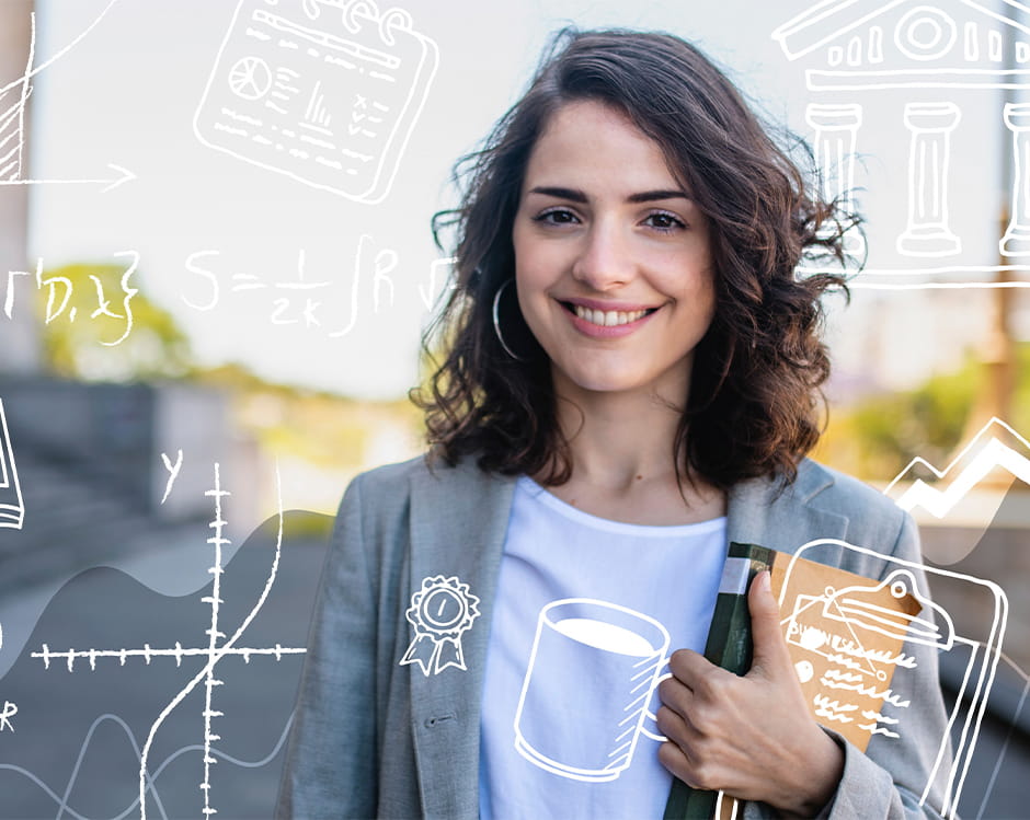 Woman looking directly into camera smiling and holding a book