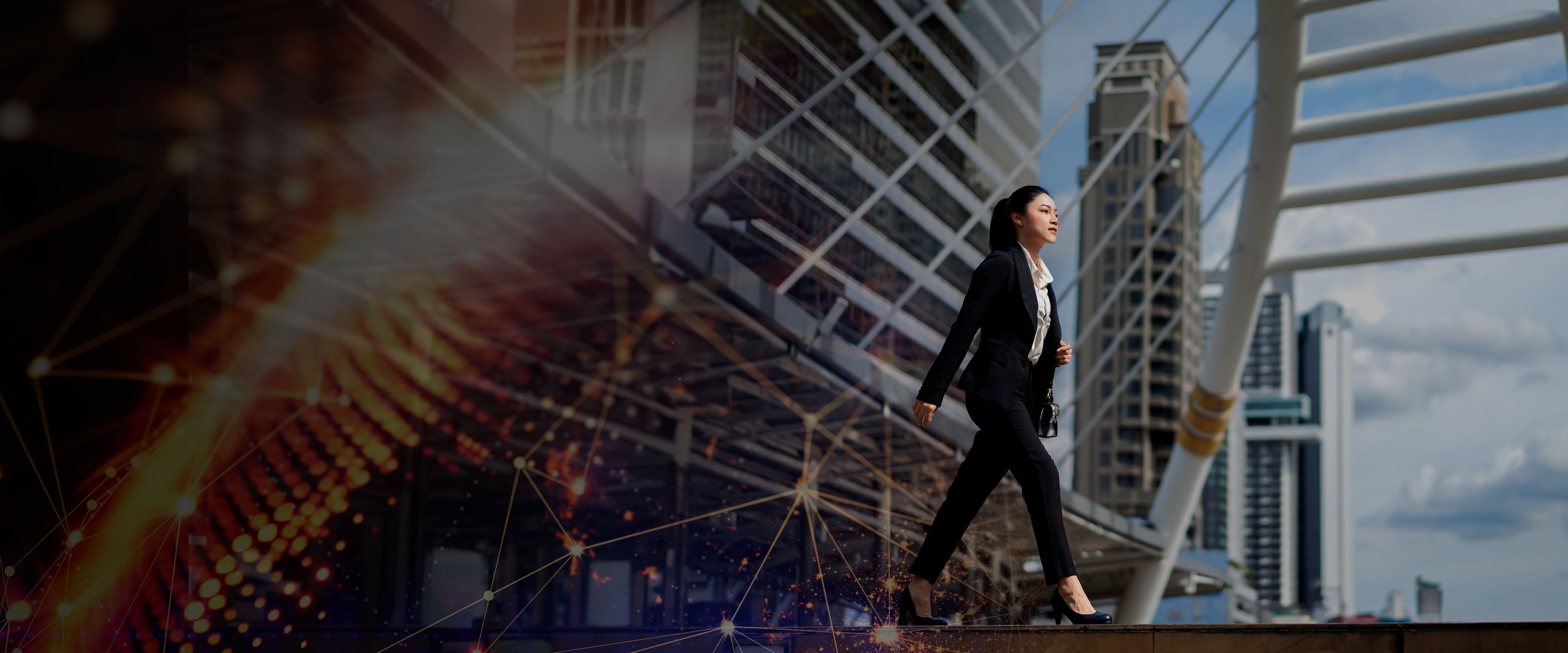 An asain woman walking with a bridge in the background