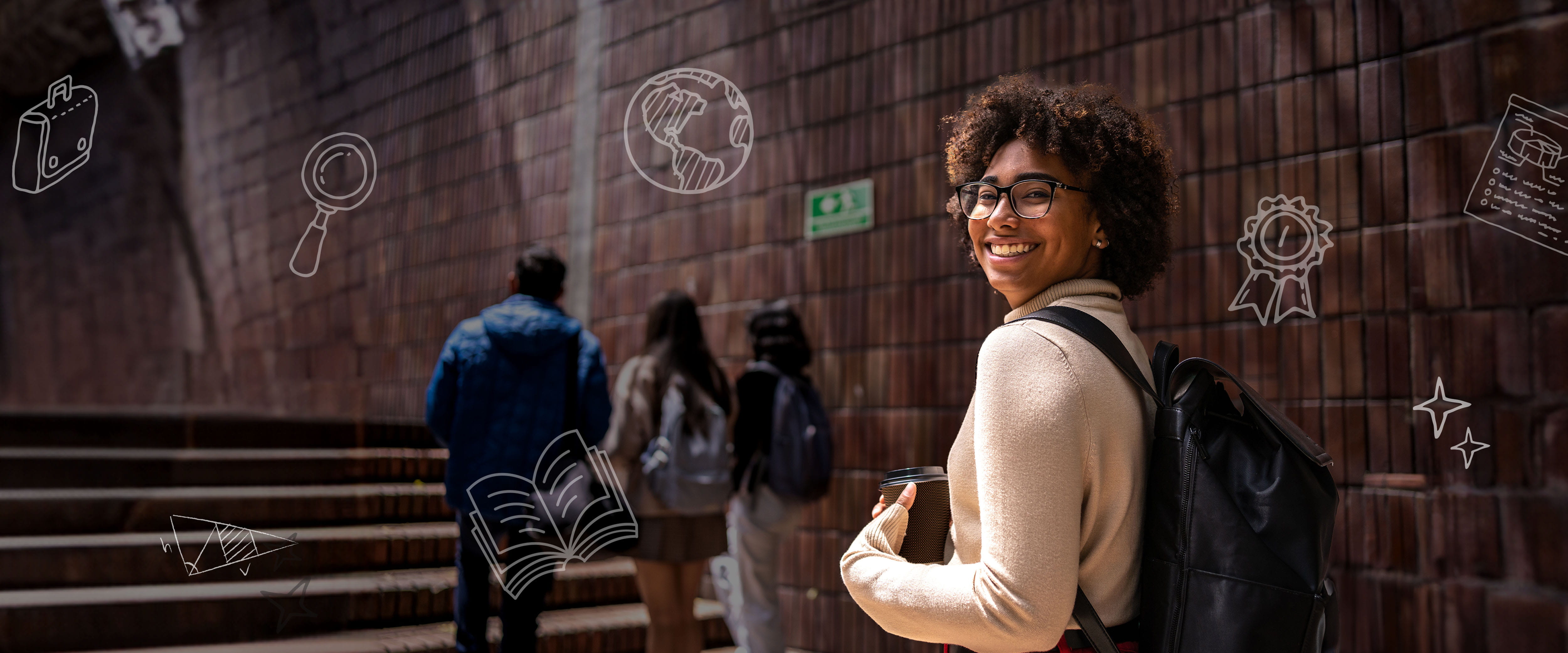 A woman with glasses and looking over her shoulder smiling