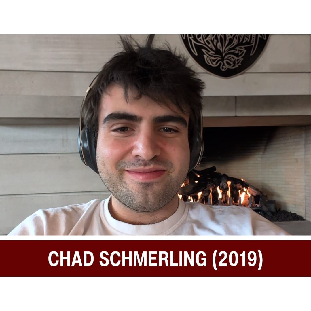 Picture of smiling dark-haired man wearing a white shirt and sitting in front of a fireplace. A red strip beneath the picture is overlaid with white text that reads: Chad Schmerling (2019)