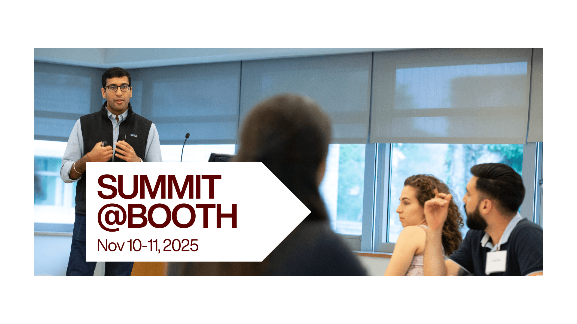 Image of brown-haired student presenter in front of a group of students. A white arrow box is overlaid over the image. The text reads: Summit@Booth, Nov 10-11, 2025. 