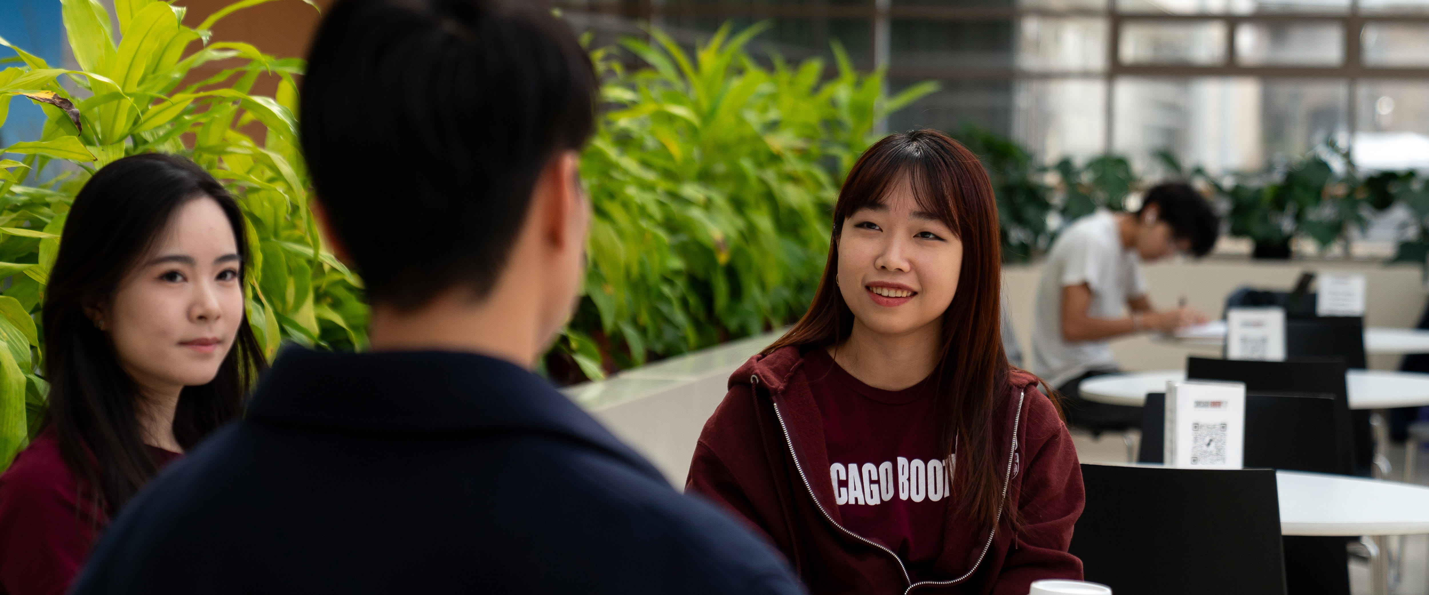 Two students talking to eachother.