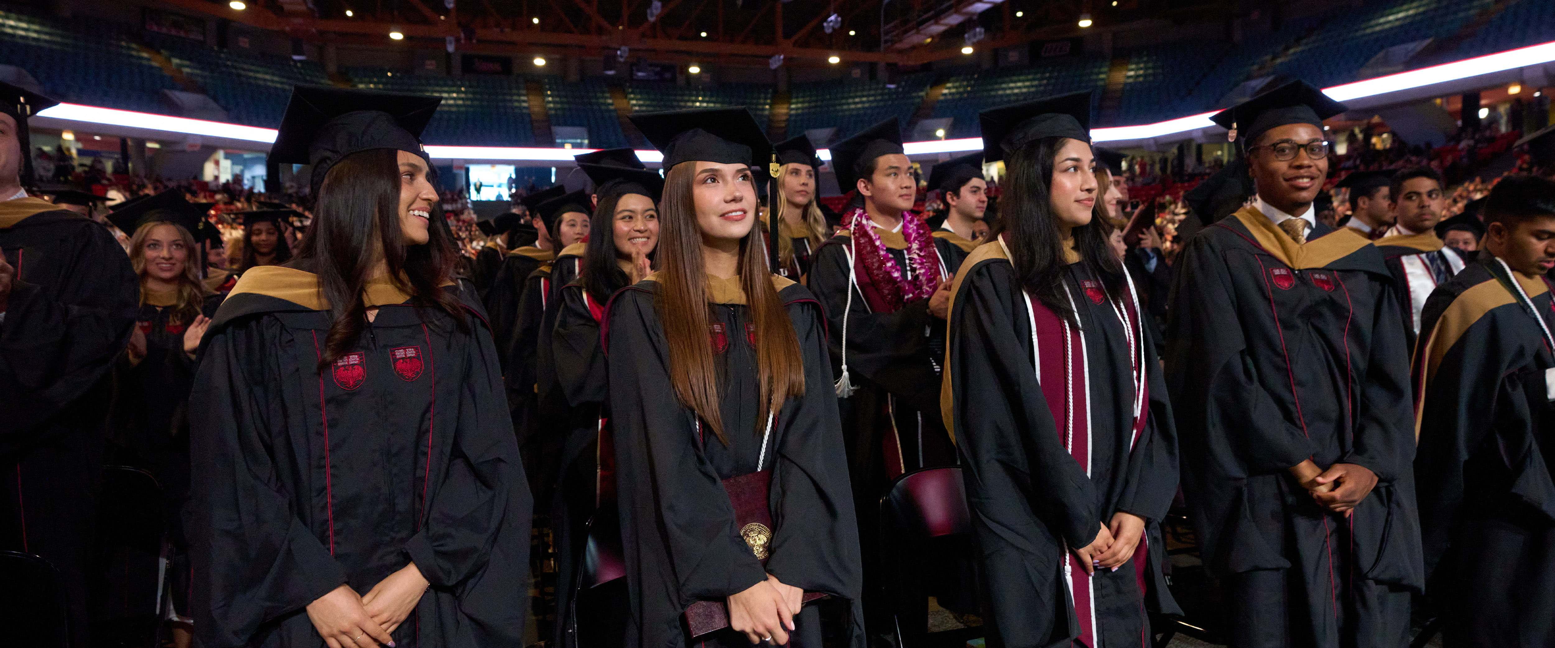 Students looking forward during their graduation.