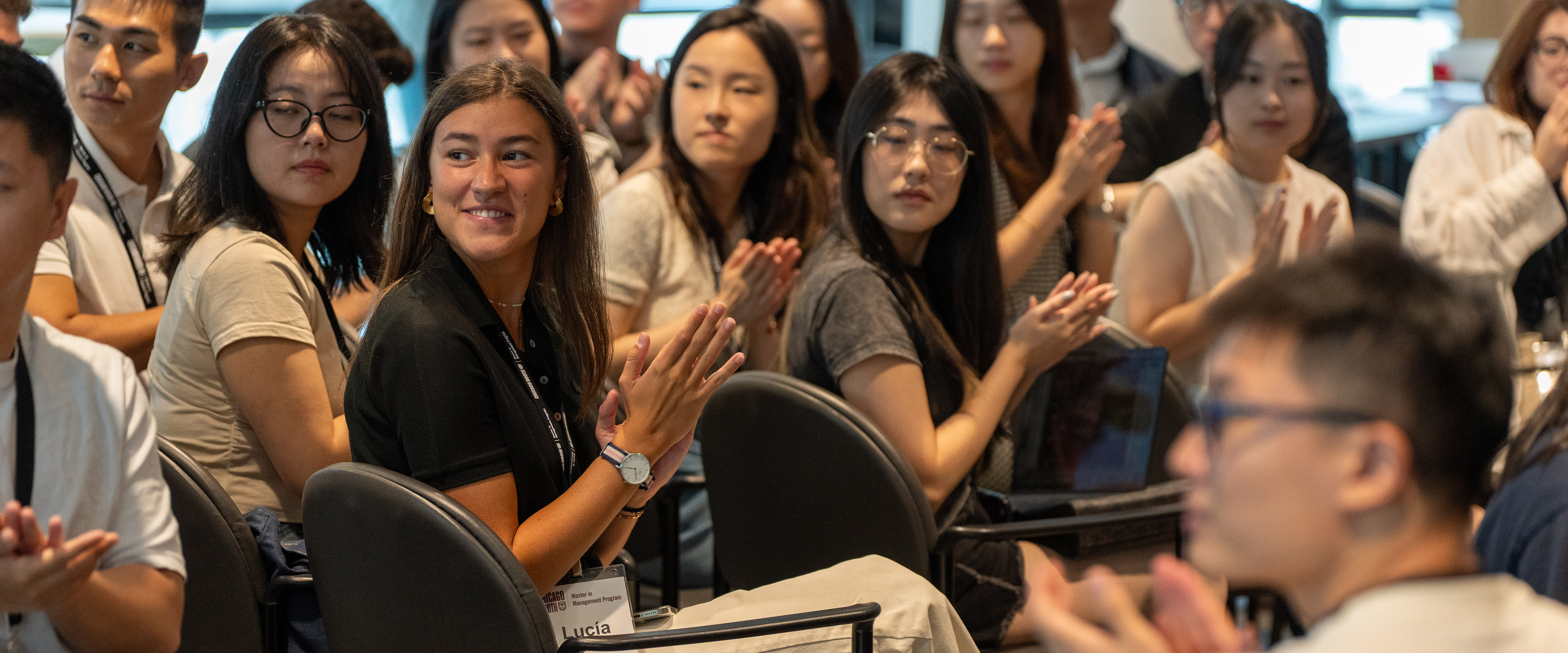 Students clapping during a presentation at Booth Camp.