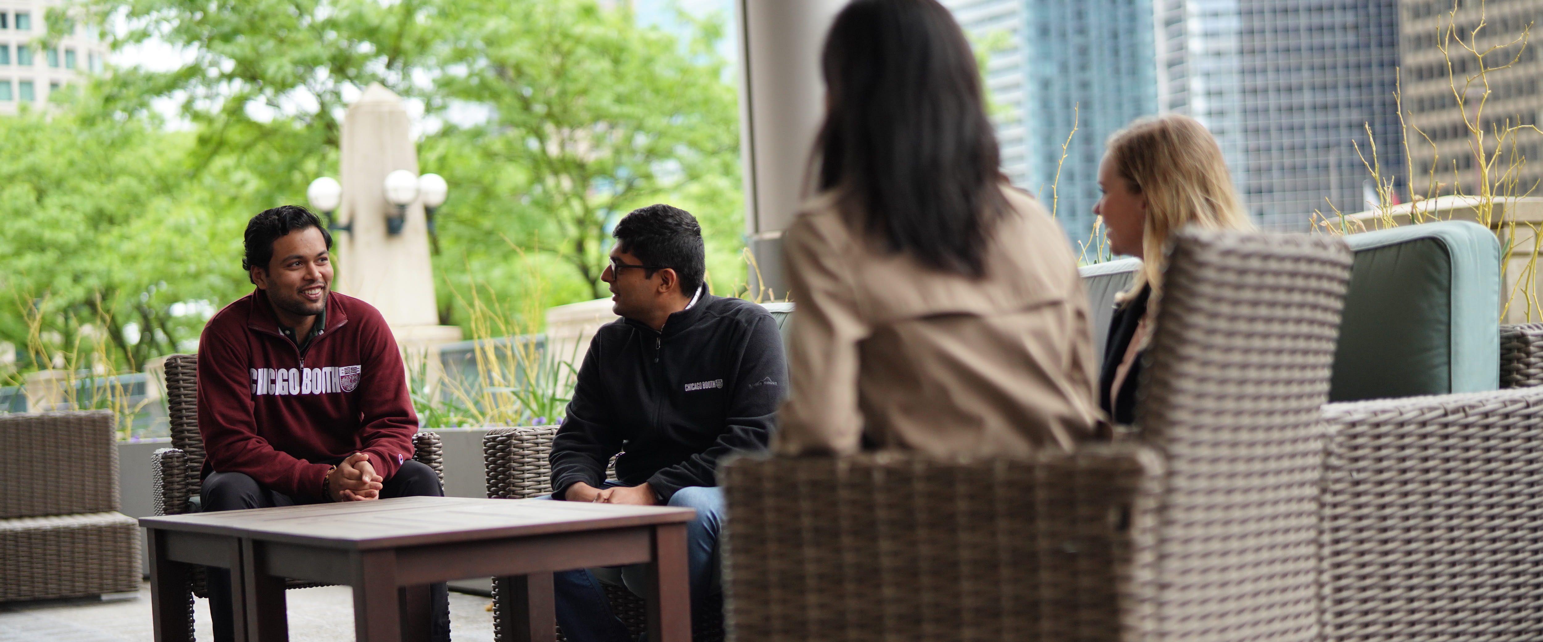 Students socializing outside Gleacher Center