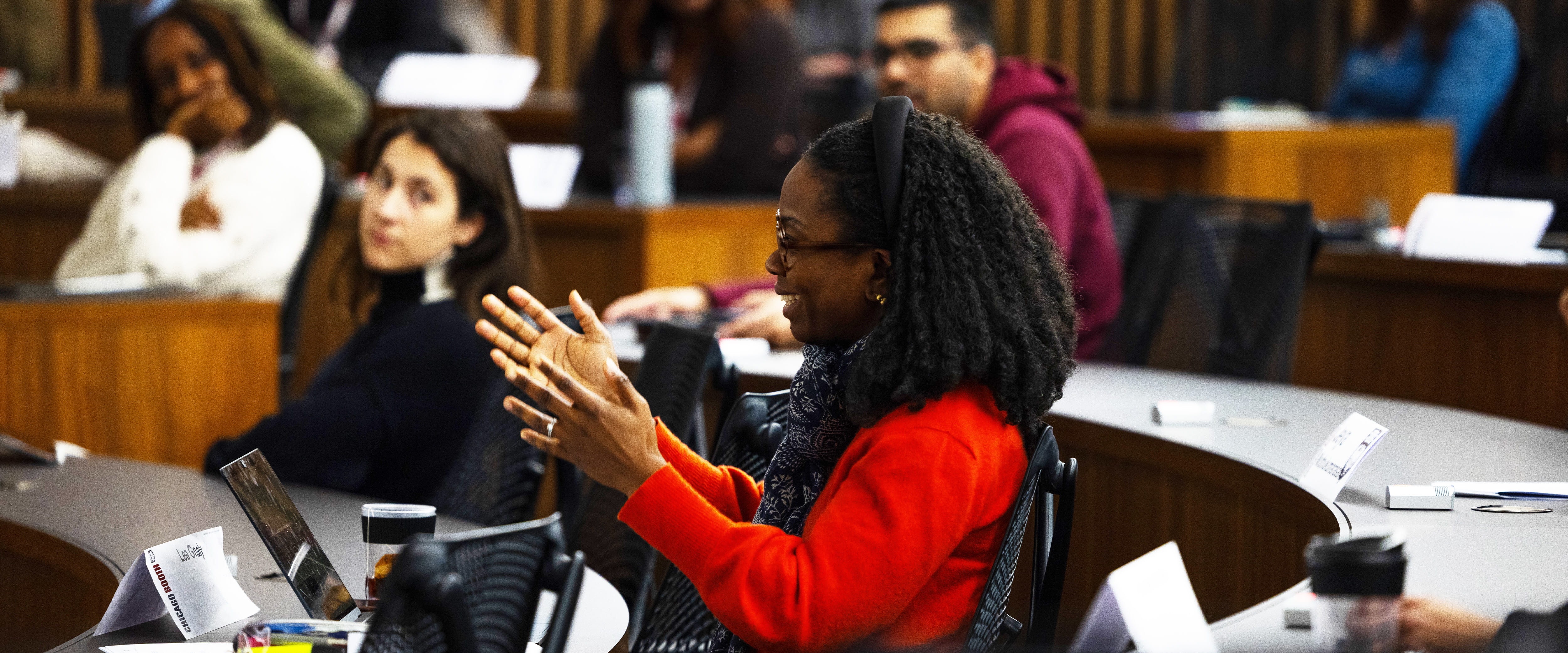 Student asking a question in London campus classroom
