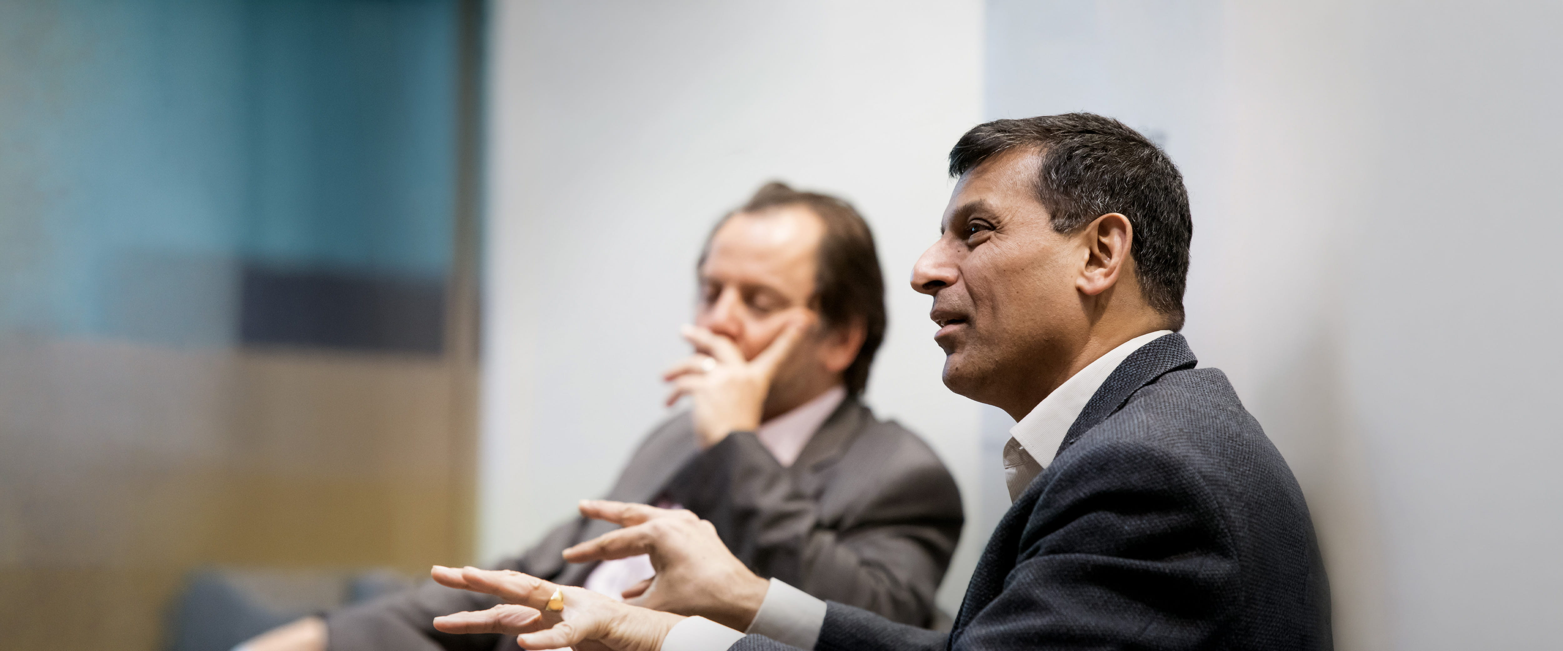 Raghuram G Rajan speaks to an audience while sitting down.