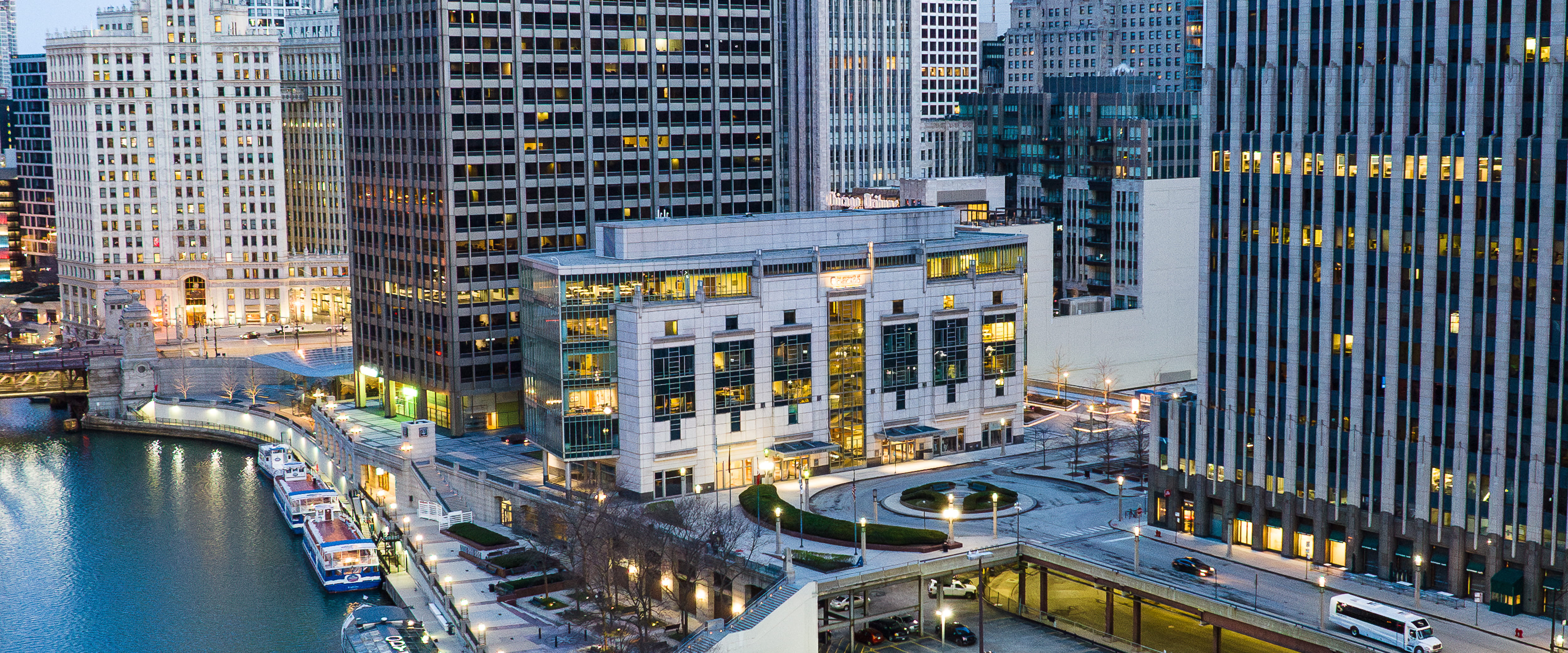 Sky line view of the Gleacher Center at sunrise.