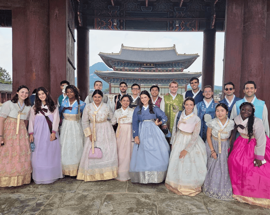 Students wearing traditional South Korean dresses.
