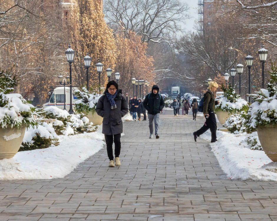 Students walking in the snow.