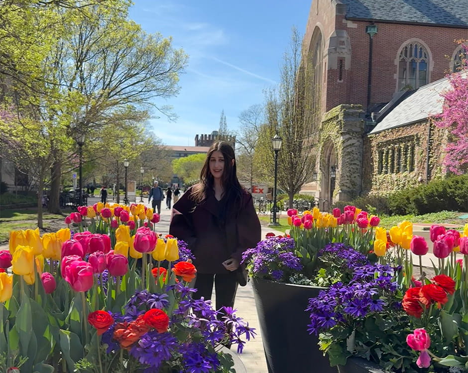 Caroline Jobson walking between flower patches.