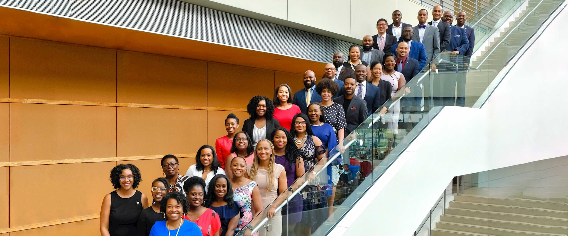 2019 IMPACT Fellows posing on stairs at Harper Center