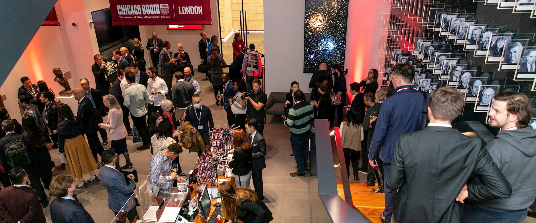 Atrium of the Chicago Booth London Campus full of people during the grand opening