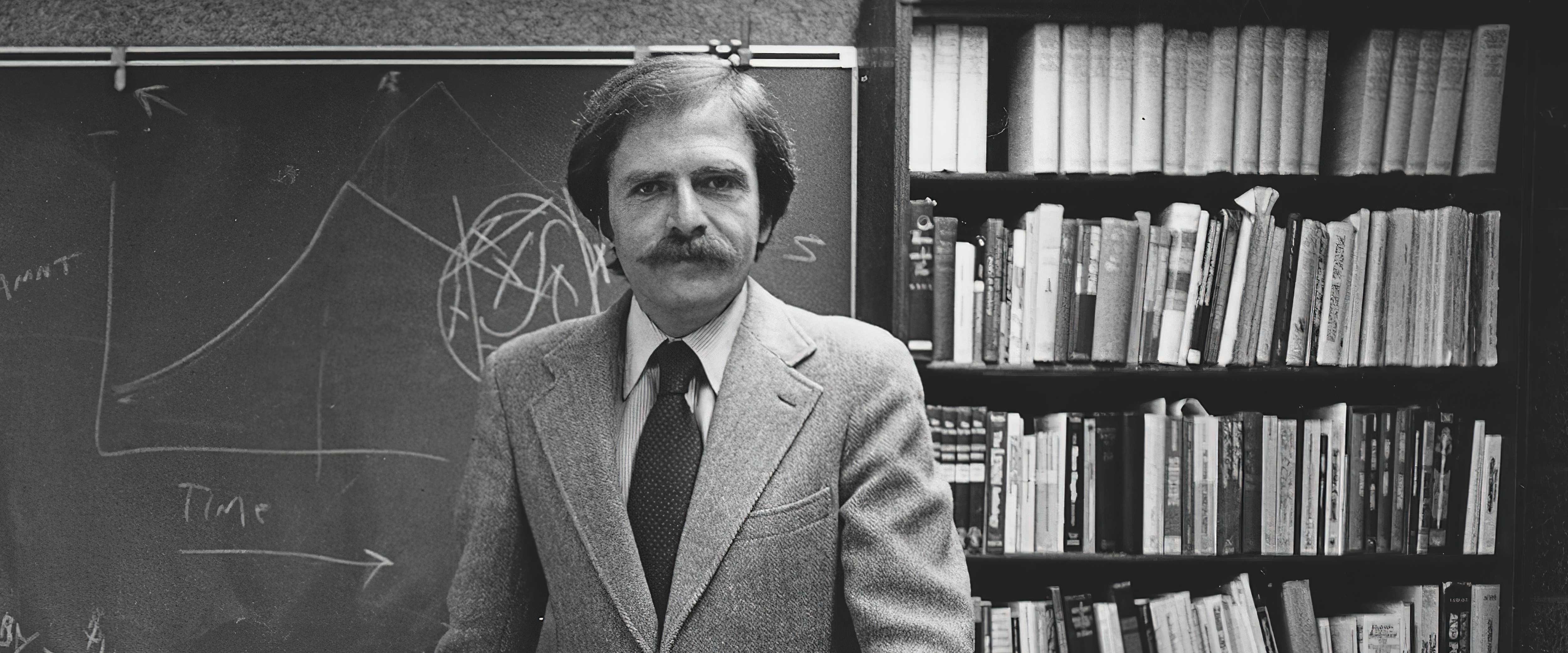 Marvin Zonis in front of a chalkboard in 1979