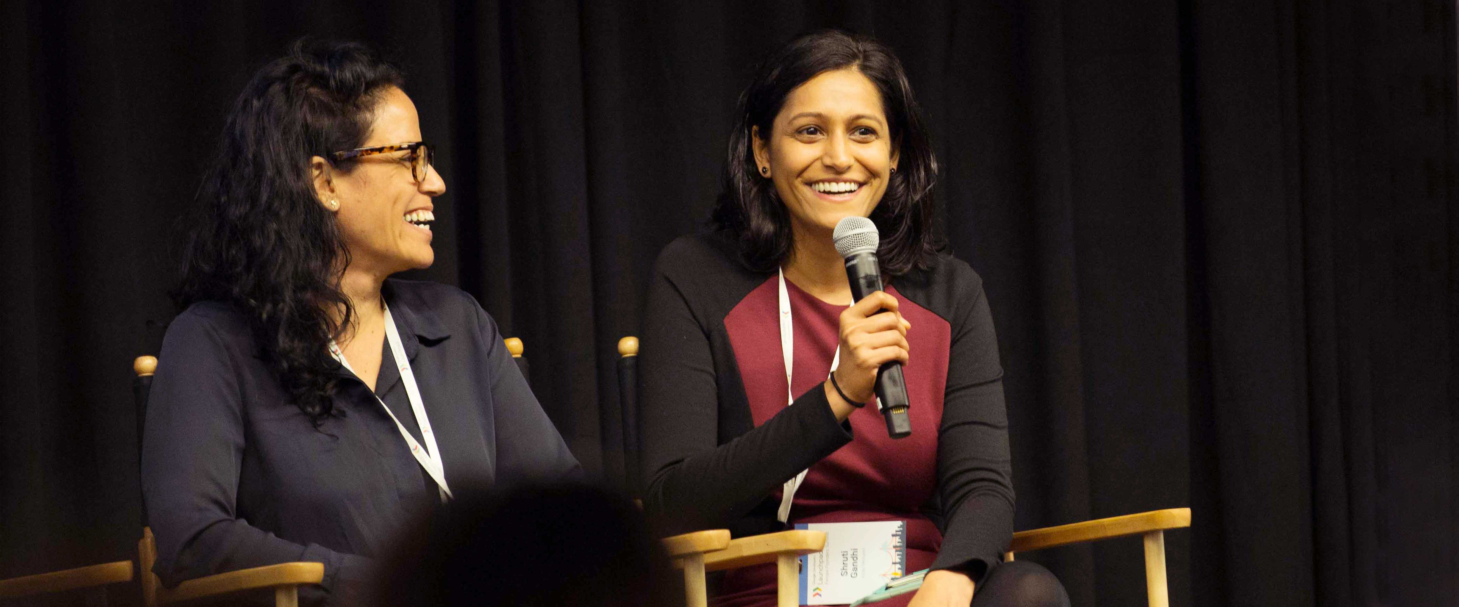 Shruti Gandhi speaking on the dias