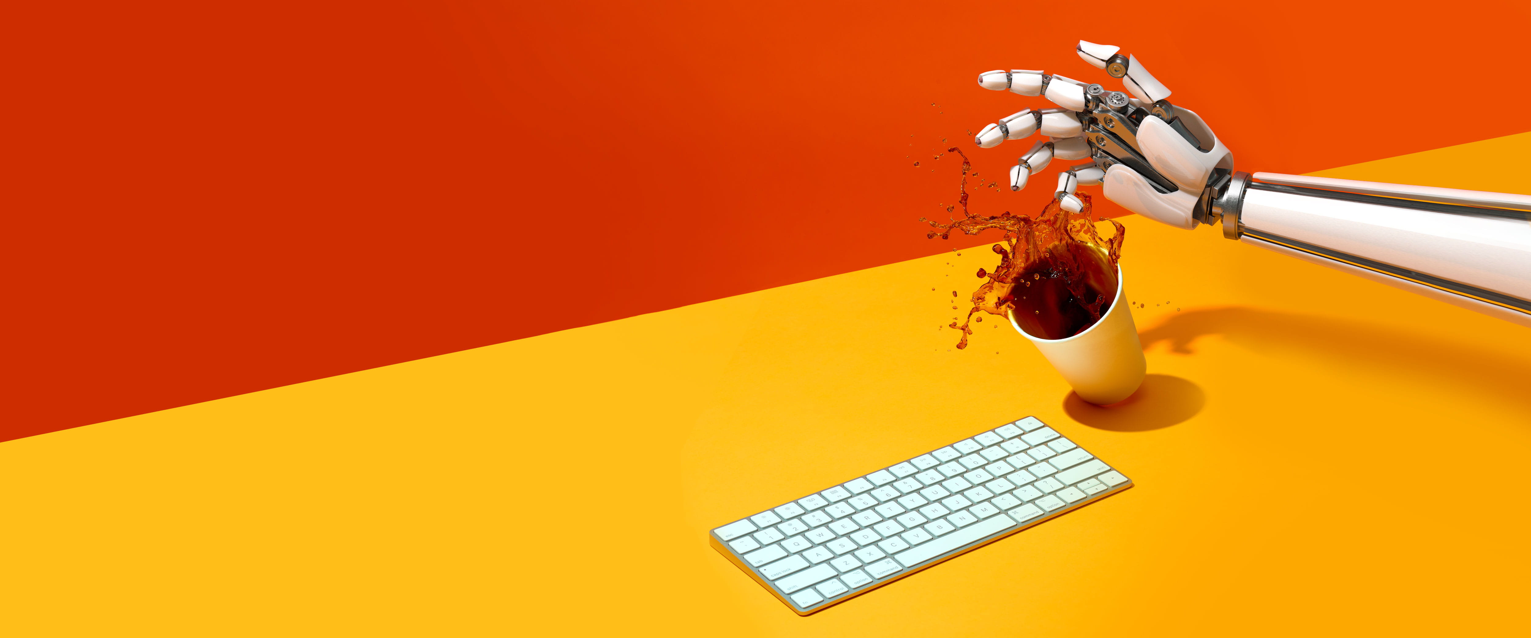 Robot arm spilling coffee on a keyboard
