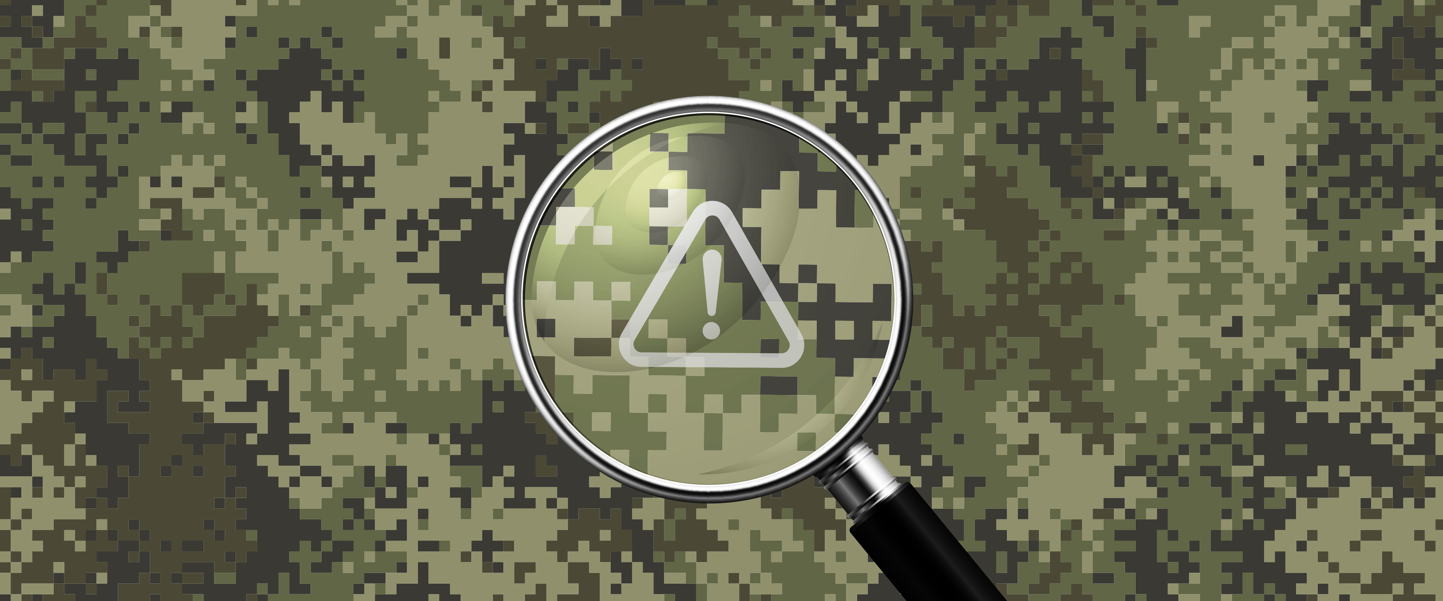 Magnifying glass on warning symbol