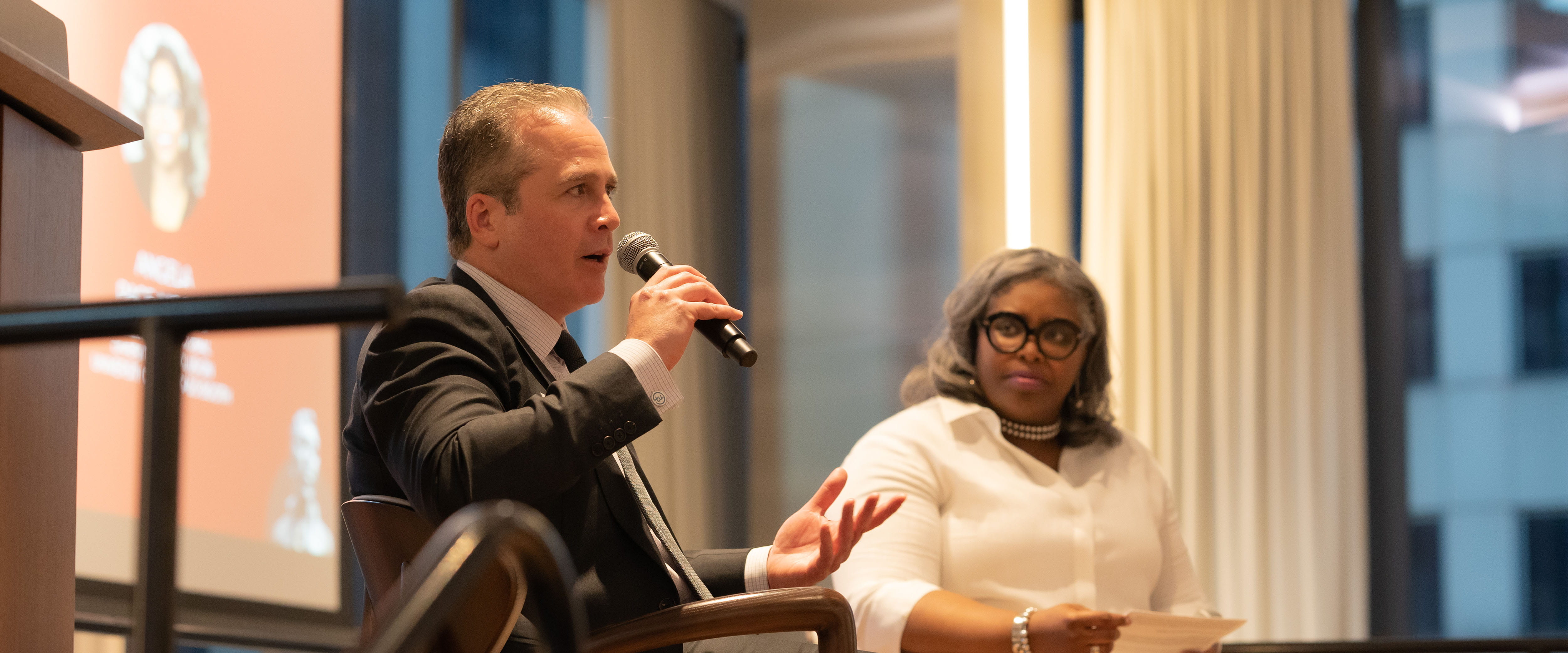 Steve Chaouki with Angela Pace Moody speaking from the dias