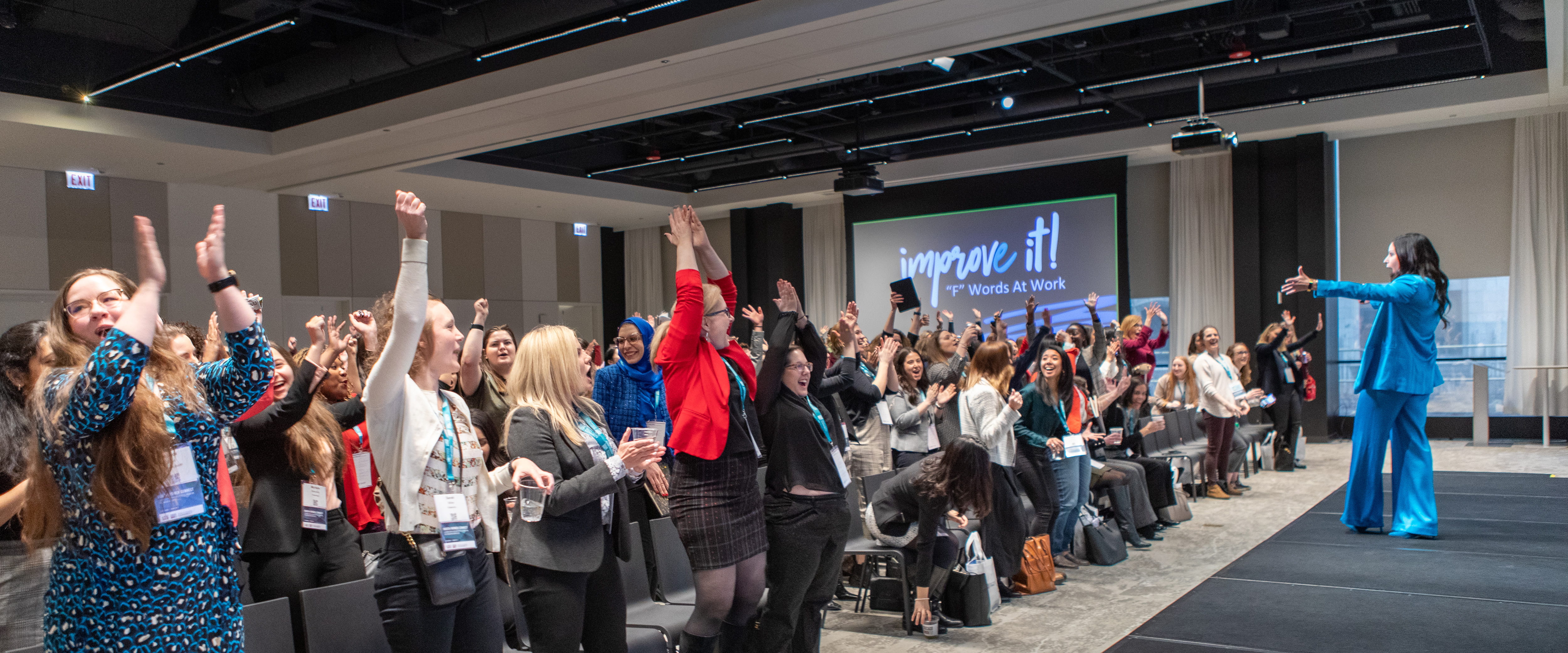 Erin Diehl cheering with an audience during a speech